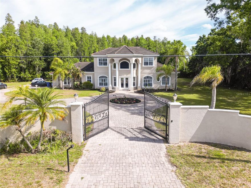 BEAUTIFUL CUSTOM BUILT HOME BY THE ORIGINAL OWNER LOCATED IN LUTZ ON A DEAD END ROAD.THIS HOME HAS  A LARGE FOYER ENTRANCE WITH A CUSTOM BUILT SPIRAL STAIRCASE. HOME HAS 5 BEDROOMS, 5 FULL BATHROOMS, 3533 SF,  3 CAR GARAGE. PRIMARY BEDROOM AND 2ND BR LOCATED ON FIRST FLOOR. 3 BRS WITH ENSUITE BATHROOMS ON 2ND FLOOR. KITCHEN HAS NEW REFRIGERATOR, OVEN, STOVE LOOKING INTO FAMILY ROOM WITH FIREPLACE. BEAUTIFUL ENCLOSED POOL WITH LARGE COVERED LANAI, ON 7.5 ACRE CONSERVATION LOT. NO HOA OR FLOOD INSURANCE REQUIRED.