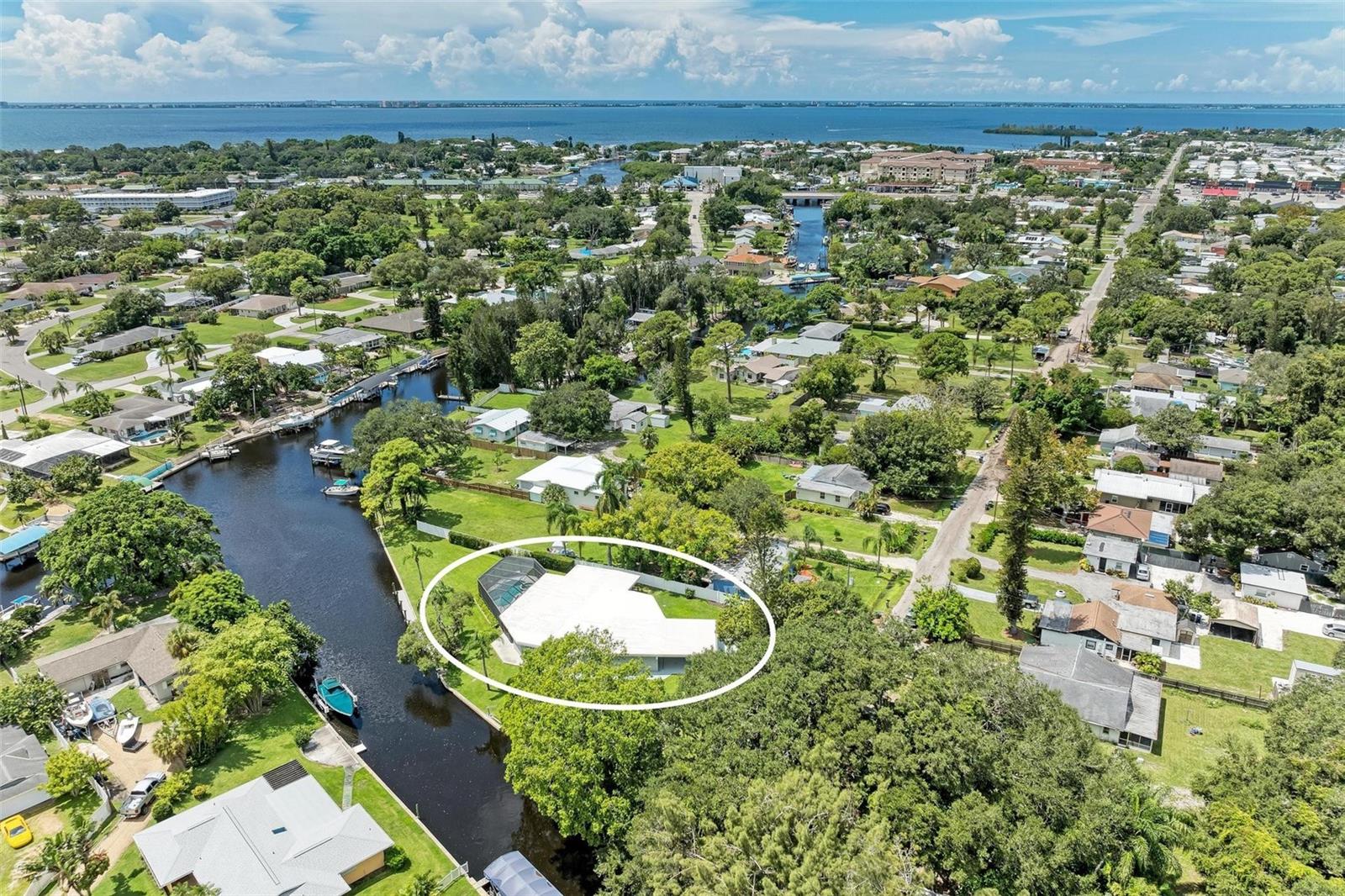 BOATERS DELIGHT…If you're a boating enthusiast, this property is truly a dream come true! Whether you're planning a day on the water to get away from it all, fishing to catch the BIG one, or just enjoying the Gulf Coast's serene waterways, this location offers unmatched convenience and access. Located on Bowles Creek this fine home is just a few minutes to Sarasota Bay and the Gulf beyond (See the Photo Above). OK, you know it’s on the water but what else might you like about this amazing property? If you’re Looking for LIKE NEW with a mid century modern feel you've met your match!!! Completely renovated and featuring: A wide open floor plan ideal for entertaining, a “Center Piece” Kitchen that offers all new custom KraftMaid cabinetry (soft close of course), Top of the Line Café style appliances the family chef will love, a Bosch DW so quiet you won’t know it’s running, a induction cook top and a double oven that allows you to get fancy if you like. There's a breakfast bar that seats 6, a Walk In Pantry to stock up on “Bogo Thursday” deals and luxurious Grey Sky Granite counter tops sure to impress even the most discriminating buyer! Manhattan Collection Whitish Clay LVT flooring throughout, a Wet Bar/Coffee Stop for your “first cup” of the day or the libation that settles you into the evening after a day at the beach. Pocket doors across the back of the home provide wide open access to the outdoor entertainment area, offering two setting areas, custom Privacy Curtains and a HEATED POOL AND SPA. Zoned A/C for efficiency and personalized preferences, an additional room currently set up as a gym but designed for expansion of the master bath, an oversized "climate controlled" two car garage PLUS a carport for guests, a workshop big enough for all dad’s tools, RV ELECTRIC HOOK UP AND TANK FULSH, Storm Shutters for all openings, TWO SHEDS that are water and electric ready...the list just goes on and on! OH, and did I mention the new 60’ Trex deck Dock, where you boat awaits to take you out for a day of fun on the Waterways of Florida’s West Coast. Located convenient to IMG ACADEMY, Downtown Sarasota and the Beaches of Anna Maria Island and Longboat Key. This home is perfectly tailored for anyone who loves life on the water. Don't miss your chance to experience the ultimate boater's paradise! Call Today and start home tomorrow!