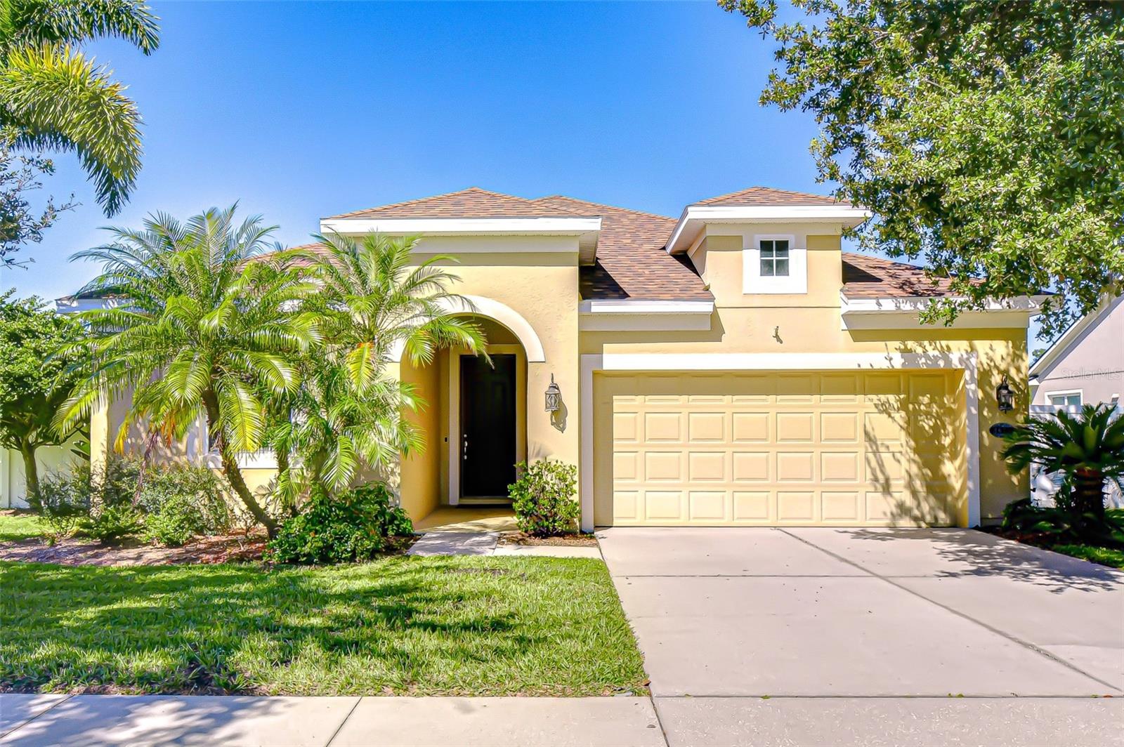 One or more photo(s) has been virtually staged. Welcome Home to this inviting, well-maintained & move-in ready 3 BR/2 BA/2-car garage home in the community of Fern Grove w/ NO CDD FEES, LOW HOA FEES & HIGHLY RATED SCHOOLS! RECENT UPDATES include NEW ROOF (FEB 2025), neutral interior paint (2025) & A/C (2024). The open floorplan enjoys high ceilings, beautiful luxury vinyl plank flooring & a split bedroom design, while the versatile formal dining room features crown molding, arched openings & detailed baseboards. The living room & breakfast area are both adjacent to the spacious kitchen with granite counters, stainless steel appliances, breakfast bar, recessed lighting & pantry. The spacious primary bedroom features crown molding, ceiling fan and an ensuite bath w/ double sink vanity, garden tub, separate walk-in shower & large walk-in closet. 2 additional bedrooms and a 2nd full bath round out the floorplan. The lush exterior of the home features an irrigation system, covered lanai & fully fenced backyard w/ vinyl privacy fencing and fruit trees. The home is also on a cul-de-sac street w/ no through traffic. The community of Fern Grove is conveniently located only minutes from I-4, I-75, Selmon Crosstown Expressway, MacDill AFB, shopping, dining, entertainment, beaches, hospitals, theme parks & all the Tampa Bay area has to offer!