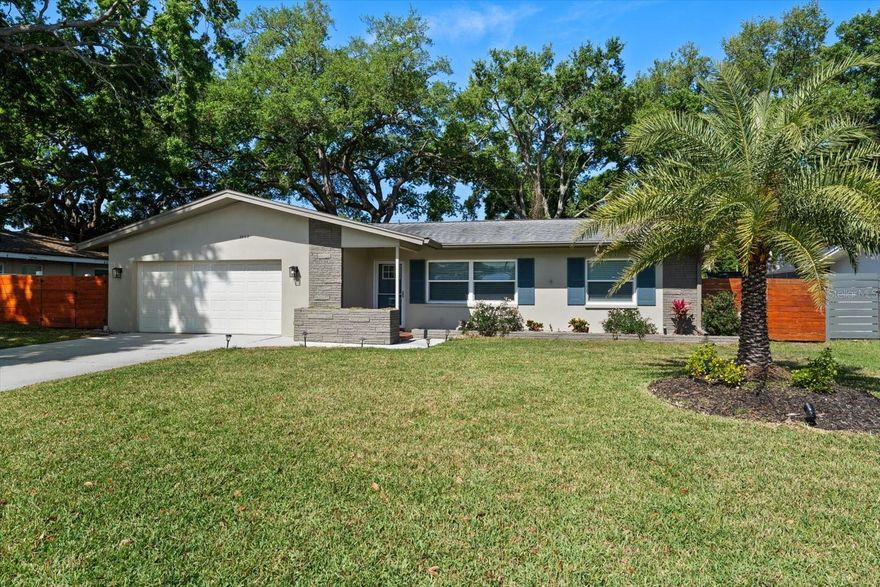 Nestled within the sought-after Fairway Estates community in Dunedin, this beautifully and extensively renovated pool home captures the essence of effortless Florida living. From the moment you arrive, you’re welcomed into an open-concept design filled with abundant natural light, where every detail has been thoughtfully updated—from new doors and flooring to upgraded plumbing and a whole-house water filtration system. At the heart of the home, a stunning new kitchen showcases timeless white shaker-style cabinetry, gleaming granite countertops, and a layout designed for both everyday living and entertaining. The desirable split-bedroom floor plan offers privacy and comfort, highlighted by a spacious primary suite featuring a custom closet and direct access to the pool. The ensuite bath is elegantly appointed with a granite-topped vanity and a large walk-in shower, creating a spa-like retreat. Additional bedrooms are equally inviting, offering generous closet space and sharing a beautifully renovated hall bath with a tub/shower combination. A versatile 150 square foot flex room (not included in the heated square footage) would be ideal as a home office, playroom, or bonus space—extends your living area and leads seamlessly to the outdoor oasis. Here, an enclosed pool and patio with new pavers invite relaxation, while a covered pergola and built-in firepit set the stage for unforgettable evenings under the stars. Lush green space and mature trees surround the home, adding to the sense of privacy and tranquility. Additional features include an outdoor shower and a customized two-car garage complete with built-in cabinetry, dedicated tool space, and overhead storage. Located in a golf cart-friendly neighborhood, you’re just a short ride from charming downtown Dunedin and the historic Dunedin Golf Club, originally designed by Donald Ross, close to shopping, restaurants, Honeymoon Island State Park and Caladesi Island, making this home not just a place to live, but a lifestyle to love.