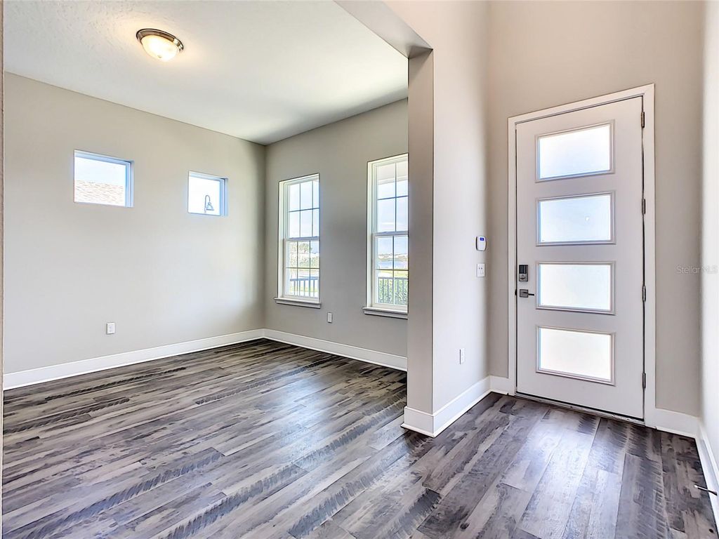 Photo of 7542 Alpine Butterfly Lane, Orlando, FL 32819 (MLS # O6398651)