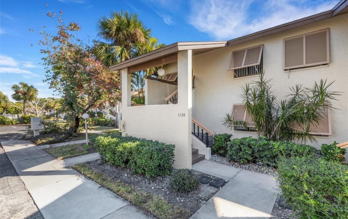 ANNUAL UNFURNISHED RENTAL IN THE MEADOWS- This beautifully renovated 2-bedroom, 2-bathroom condo in The Meadows is a fantastic rental opportunity! Situated on the second floor, it offers a serene view of one of the community's heated pools. The modern updates, including a new kitchen with Quartz counters, ocean blue tile backsplash and white appliances, new flooring, and lighting/ceiling fans as well as renovated bathrooms, make it a very appealing choice. Other features include interior laundry room, assigned and guest parking, 2 double closets in primary bedroom suite, and a split bedroom plan. The spacious screened-in lanai, accessible from both the living room and master bedroom, enhances the living experience by providing an outdoor space to relax. The community amenities, such as access to a fitness center, country club pool, walking trails, and pickleball courts, add significant value to living here. It's also conveniently located near the Meadows Community shopping village, making it easy to access restaurants, services, and other conveniences. Just keep in mind the restrictions on overnight parking for trucks and commercial vehicles, along with the requirement for a credit and background check (2-step application process) and renter’s insurance. This condo is the perfect blend of comfort, modern living, and community amenities! Available April 1st for a 12- to 24-month lease. Utilities are tenant’s responsibility.