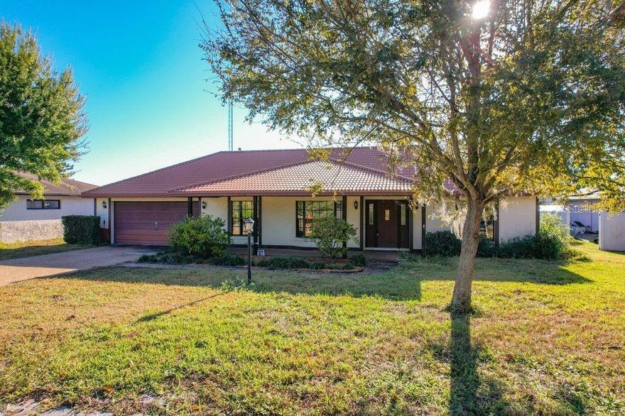 Under contract-accepting backup offers. Step into this lovingly maintained 1978 lakefront gem in beautiful Winter Haven, where timeless character meets exciting potential. Set on a stunning lake with its own refurbished private dock (2023), this home offers peaceful water views, daily wildlife sightings—think eagles, otters, and sandhill cranes—and a lifestyle that’s hard to match.



Inside, much of the home retains its original 1978 finishes, offering the rare chance to create a truly unique, gorgeous, and character-rich living space. You’ll immediately notice the soaring vaulted ceilings accented by real wood beams and trim, a classic feature you can’t recreate today. The full-wall fireplace anchors the family room, and the bay window and majestic columns in the living room add dramatic architectural flair. The stone-floored entryway sets the tone for the home’s warm, inviting personality.



Several key updates give peace of mind, including newer attic blown insulation (2021), a new AC and water heater (2025), and a durable 50-year metal roof (2003). The home is connected to public water, public sewer, and natural gas, and also offers the security of a Generac whole-home generator system. With two hot water heaters, comfort is always well supplied.



The layout features three bedrooms plus a fourth bedroom/den/in-law suite complete with its own en suite bath. Two of the bathrooms have been tastefully remodeled, and newer flooring appears throughout much of the home. The primary suite includes two walk-in closets and even a built-in wall safe for added convenience.



For hobbyists and organizers, the garage is a dream—fully equipped with peg boards and storage shelving. The home also includes an original whole-house vacuum and original security system (both unused by current owners) for those who appreciate vintage features with restoration potential.



Enjoy Florida living on the expansive screened-in back porch, perfect for watching lakefront sunsets or entertaining guests. Best of all, this property is not in a flood zone, adding security to its incredible location.



Cherished by the same family for many years, this one-of-a-kind home is ready for its next chapter—whether you embrace its 1978 charm, update it into something spectacular, or both. Opportunities like this don’t come around often.