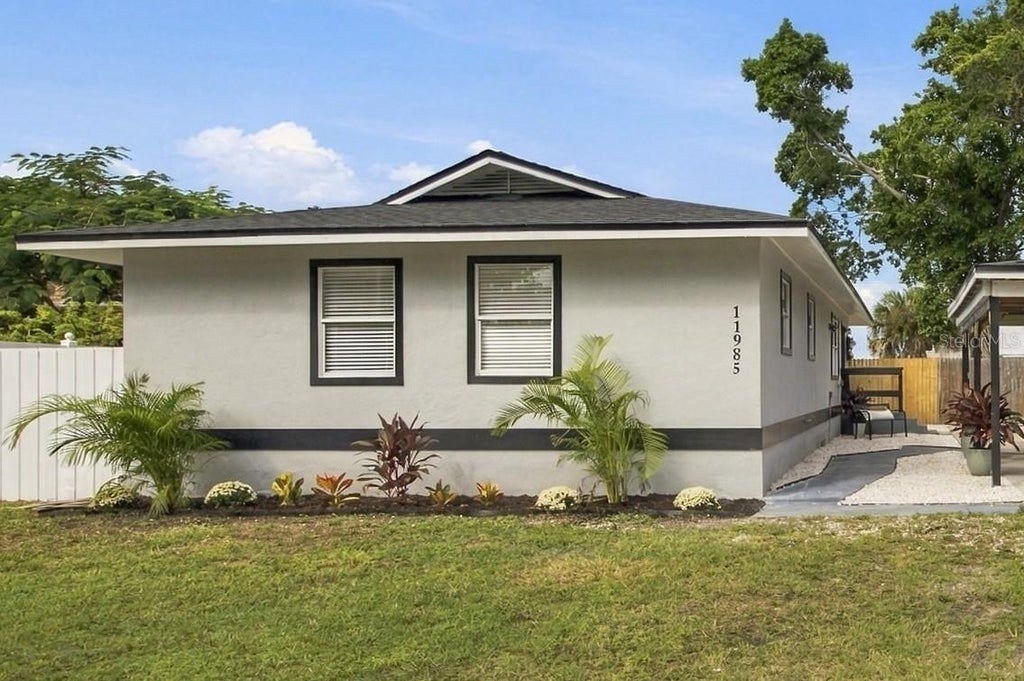 Photo of 11985 Murray Avenue, Seminole, FL 33778 (MLS # TB8552404)