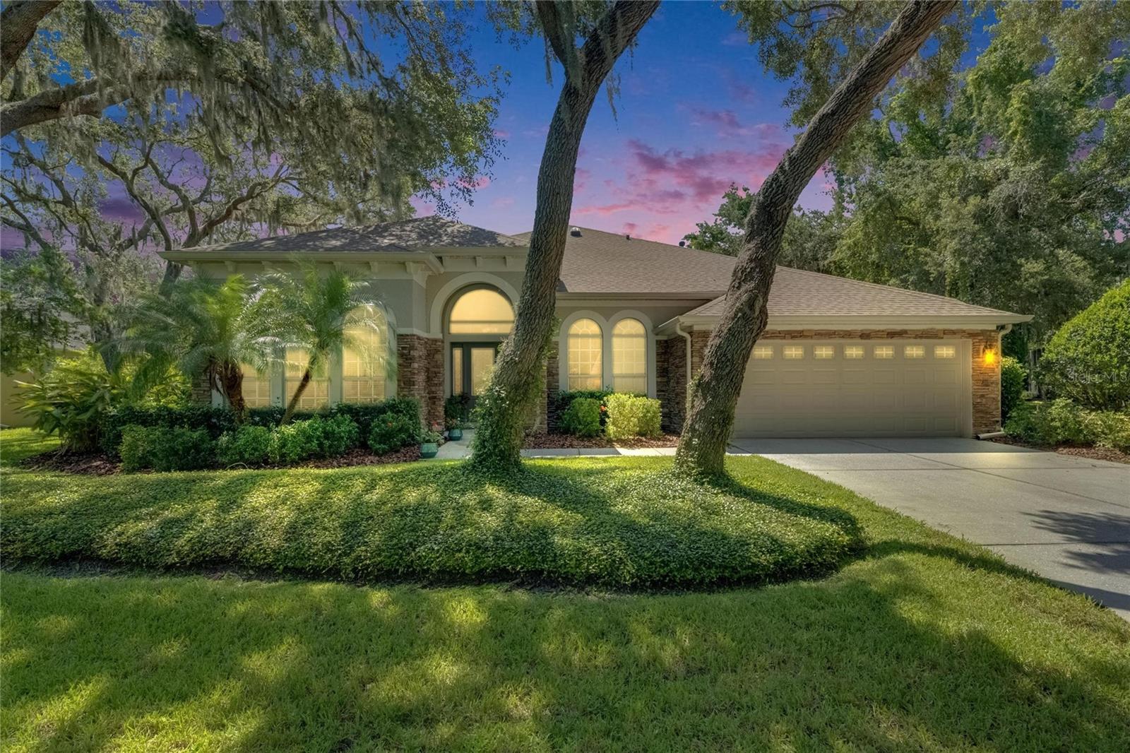 Gorgeous Florida Dream Home nestled on a private 1/3 acre conservation lined lot in the highly desirable gated community of TERN WOOD in FishHawk Ranch. This David Weekley built 4 Bedroom, 4 Full Bath 'Clancy' open floor plan has it all! Featuring a newly remodeled kitchen (2025) and resort style pool with large sun deck and spa, 4 spacious bedrooms, 4 full baths, a versatile bonus/game room, an oversized executive office with french doors and a 3 Car Tandem Garage. Renovated throughout, this home has loads of updates including a new roof (2024), new flooring throughout (2025), new interior paint throughout (2025), new water heater (2025), new pool heater (2024), new pool salt generator (2025) and much more. Upon entering the kitchen you will find an expansive quartz topped island complete with a breakfast bar, undermount stainless sink with touchless faucet and a new dishwasher (2022). Rounding out this dream kitchen is the abundance of cabinets, custom built-in pantry, wine/beverage cooler, modern light fixtures and solar tube lighting. The kitchen overlooks an eat-in area and large living room with french door access and views of the sparkling pool and wooded lot beyond. As if this all isn't enough, you will fall in love with the modern master suite featuring expansive windows, a private door to pool/lanai and a master bath ensuite with custom vanity, split sinks, separate dual headed shower, jetted tub and extra large walk-in closet complimented with built-in organizer system. FishHawk Ranch is a second to none community, with wonderful amenities including over 30 miles of walking trails, pickleball and basketball courts, parks and zoned for top rated FishHawk Creek Elementary, Randall Middle and Newsome High School! This home is priced to sell, schedule a private viewing today!