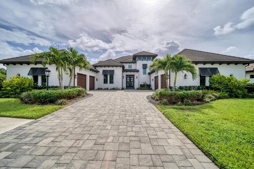 For the first time since the neighborhood sold out, seize the opportunity to own an exceptional Arthur Rutenberg custom home in the esteemed maintenance-free Legacy Estates at Esplanade on Palmer Ranch. With the backyard facing the preserve, this exquisite home sits on one of the largest and most private lots in the community. Boasting a meticulously designed 5-bedroom split floor plan with custom built closets, including a guest suite with a separate outside entrance, an oversized custom built home office, and an upper-level flex room that can effortlessly transform into a game room or sixth bedroom complete with an en-suite bath, closet and balcony, this residence perfectly balances privacy and communal living. Vanishing pocket sliding doors and soaring 12 foot ceilings merge with the outdoor oasis that beckons with an oversized heated salt water pool and spa, panoramic lanai screens, and a custom built-in outdoor kitchen. Culinary enthusiasts will be enthralled by the GE Monogram appliances, double dish washers, an Advantium oven, a Subzero refrigerator, a wine refrigerator, and a large walk-in pantry. Modern convenience takes center stage, showcased by the oversized 4-car garages, prewired security cameras, cat 6 wiring, dual energy efficient AC units with 7 different zones, double washers and dryers and a second full size refrigerator in the laundry room, impact windows, hurricane bunker room, and a pad prewired for a generator, ensuring your peace of mind. Smart home features such as Nest thermostats, garage doors, lighting, pool/spa controls and front door locks all controlled from your phone offer contemporary comfort. Embrace resort-style living with the community's array of amenities, including a lifestyle director and a full social calendar, an elegant amenity center, a full-service restaurant, an athletic center, beach entry community pool, resistance pool, tennis, pickleball, bocce courts, multiple dog parks, walking trails, and a private Legacy Trail access down the street from the house, making this home the ultimate haven of elegance and sophistication amidst a vibrant community.