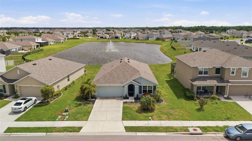 Wake up to a beautiful water view in this gently used D.R. Horton Aria model, where the vibes are high and the maintenance is low. If you’ve been dreaming of that "model home" feeling without the "construction zone" headache, you just found your match! Expect that famous D.R. Horton flow—open, airy, and drenched in sunshine. Skip the builder waitlist and the "new house" dust. This beauty is turnkey, stylish, and looking for its next favorite human. There is absolutely no carpet here. We’re talking sleek, seamless flooring throughout that’s ready for your autonomous vacuum to have the time of its life. Spilled some wine? Golden Retriever shedding? No problem, just a quick swipe and you’re back to relaxing. The backyard isn't just a yard; it’s your personal front-row seat to the lake. Grab your binoculars or just your morning coffee and enjoy the expansive views across the water. You’ll love watching the neighbors across the lake host their weekend BBQs or try (and fail) to set up that giant inflatable slide. It’s all the entertainment of a neighborhood community with the perfect "water buffer" for your own privacy. This home has been loved just enough to ensure everything works perfectly, but not enough to lose its sparkle. It’s pristine, polished, and ready for you to move in and start making memories on day one. The kitchen is a total showstopper, perfect for everything from gourmet meal prep to being the "hub" for the best Sunday brunch in the zip code. Ready to wake up to that view (and see what the neighbors are up to) every single morning? Come see it before someone else claims your sunrise!