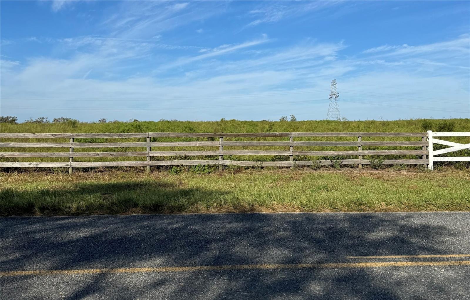 New “HARMONY ESTATES” has convenient access to The Villages with 2-minute drive for shopping, restaurants, medical and entertainment.
This 11.01 acre property is just one of six 11-13+ Acre Country Parcels which could be combined. NO HOA, fees and NO wetlands. Cleared, improved pastureland with paved road frontage and protective covenants. Zoned A-1 for gardens and farm animals. If you are looking for a peaceful, yet convenient place to build a dream home, this is for you! Owner financing is available.