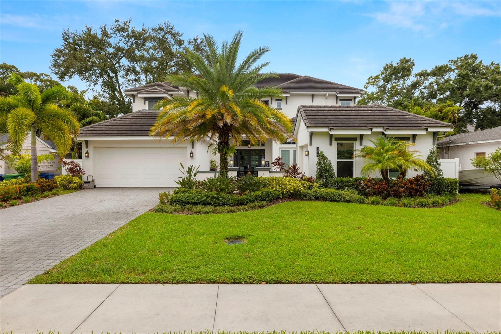 This stunning West Indies-style pool home is located in flood zone X and offers an exquisite blend of luxury and functionality. Boasting 6 bedrooms, 6 full bathrooms, and 1 half bath, this residence is designed for both comfort and elegance. The front of the home welcomes you with a spacious courtyard and a 3-car split garage. Inside, the first floor features an inviting foyer, study, great room, utility room, mudroom, and a chef's dream kitchen, complete with a butler's pantry, all open to the dining and great room. The primary owner's suite on the first floor includes a large walk-in closet for ultimate convenience. Additionally, a private guest suite with its own entry offers privacy and comfort, ideal for visitors or extended family.
The home boasts high-end additions such as a 550-gallon fish tank system, a recently installed generator, a whole-house sound system, and a state-of-the-art security system with cameras. Two brand new tankless water heaters ensure efficient, endless hot water supply.
Upstairs, you'll find four generously sized bedrooms, each with a walk-in closet and en-suite bath, along with a spacious game room for entertainment. Outdoors, a large covered patio with an outdoor kitchen overlooks the expansive pool area, providing the perfect setting for relaxing or entertaining. This home is a true oasis, combining indoor luxury with outdoor leisure for an unparalleled living experience.