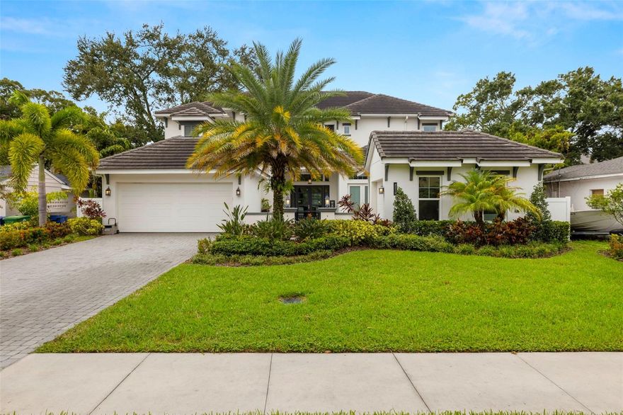 This stunning West Indies-style pool home is located in flood zone X and offers an exquisite blend of luxury and functionality. Boasting 6 bedrooms, 6 full bathrooms, and 1 half bath, this residence is designed for both comfort and elegance. The front of the home welcomes you with a spacious courtyard and a 3-car split garage. Inside, the first floor features an inviting foyer, study, great room, utility room, mudroom, and a chef's dream kitchen, complete with a butler's pantry, all open to the dining and great room. The primary owner's suite on the first floor includes a large walk-in closet for ultimate convenience. Additionally, a private guest suite with its own entry offers privacy and comfort, ideal for visitors or extended family.

The home boasts high-end additions such as a 550-gallon fish tank system, a recently installed generator, a whole-house sound system, and a state-of-the-art security system with cameras. Two brand new tankless water heaters ensure efficient, endless hot water supply.

Upstairs, you'll find four generously sized bedrooms, each with a walk-in closet and en-suite bath, along with a spacious game room for entertainment. Outdoors, a large covered patio with an outdoor kitchen overlooks the expansive pool area, providing the perfect setting for relaxing or entertaining. This home is a true oasis, combining indoor luxury with outdoor leisure for an unparalleled living experience.