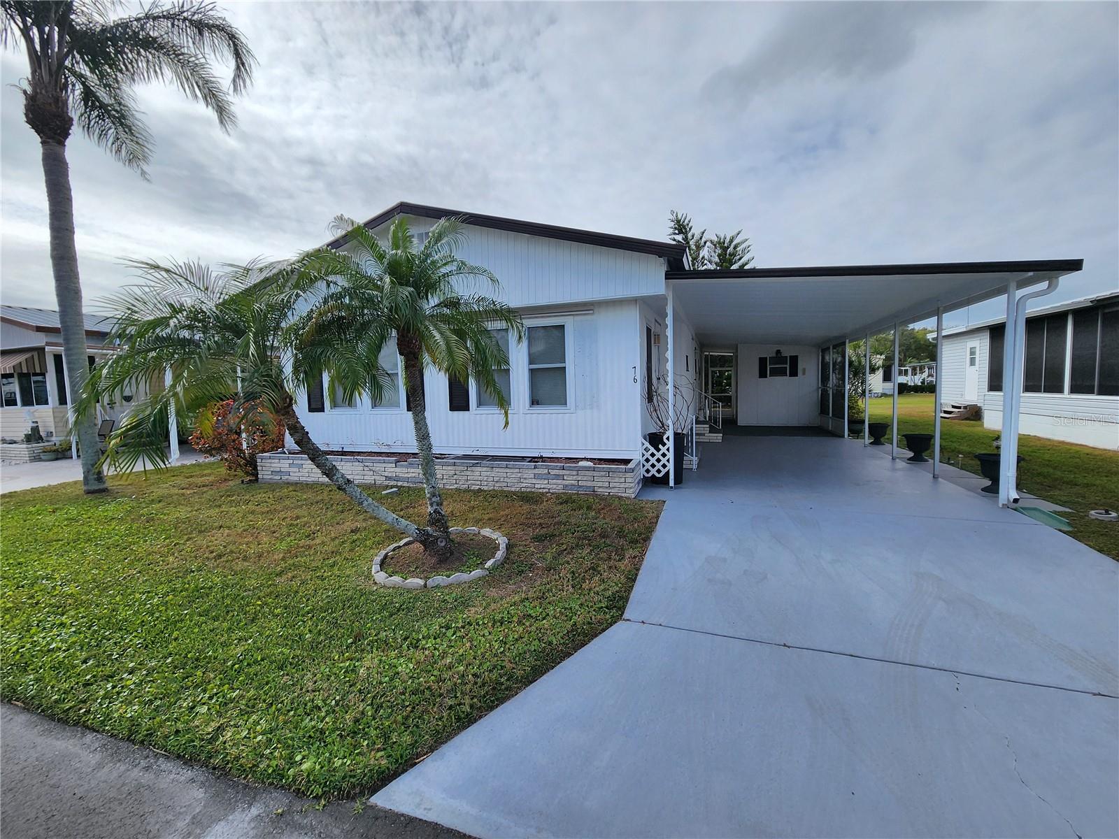 Welcome to the well-maintained 55+ community of Palm Lake Estates! This charming two-bedroom, two-bath home comes fully furnished and offers an inviting open-concept layout. It features a bright Florida room, a cozy patio out back, and an updated kitchen. The home’s exterior has been freshly painted, and the washer and dryer are conveniently located in the utility shed. Best of all, there’s NO LOT RENT! Enjoy a LOW maintenance fee of just $225/month, which covers water, sewer, trash, cable, internet, a community pool, shuffleboard, a clubhouse, and an on-site manager. 2025 seller has put in a new water heater and a new electrical panel. Ideally located, you’ll be close to shopping, restaurants, and the airport, with the beautiful beaches only minutes away. Whether you’re looking for a warm winter retreat or a year-round home, this community has a vibrant lifestyle with plenty of activities to enjoy. Don’t miss out—come see it today! WHERE CAN YOU LIVE FOR LESS?