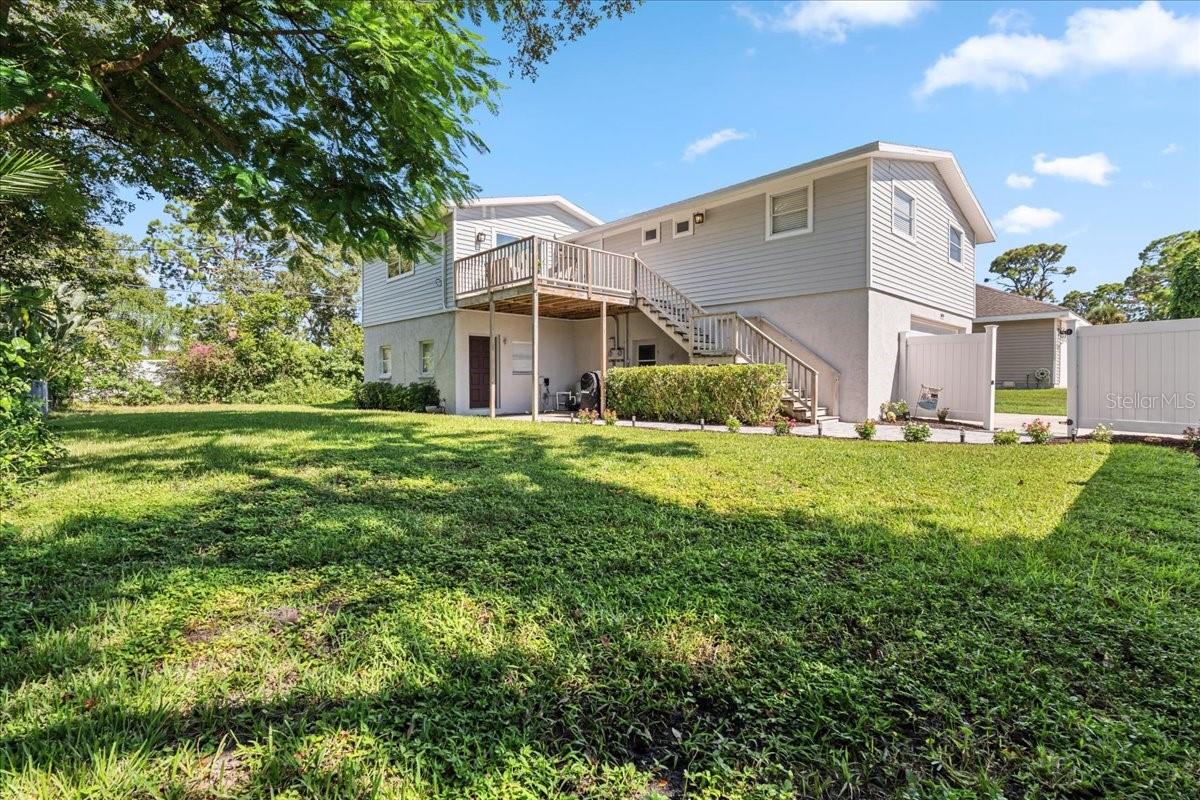 This ONE OF A KIND property is in the PERFECT LOCATION in Venice! Golf cart to Manasota beach from this home! This is a true 3 bedroom/2 bath home OR a 2 bed/1 bath+ 1 bed/1 bath in-law suite! There are laundry hook-ups in the upstairs bathroom and there are also laundry hook-ups downstairs. This home is NOT IN A FLOOD ZONE & has never flooded. BRAND NEW ROOF! There are NO CDD FEES and NO MANDATORY HOA FEES. This ADORABLE property has 1712 square feet under air and is MOVE-IN-READY! As you enter the home from the upstairs entry, you will see the freshly painted living room to the left, dining room ahead, and entry to the kitchen to the right. The kitchen renovation has just been completed to include quartz countertops, white shaker cabinets, stainless appliances, subway tile backsplash, closet pantry, and a window to the backyard. Next to the kitchen you’ll find two spacious bedrooms and a bathroom/laundry room. (If desired, you could eliminate the laundry as there are also laundry hookups downstairs. The sellers preferred to have the laundry upstairs. If the new owners use this property as a multi-generational property or rent out the downstairs, having two laundry rooms would be convenient.) Downstairs is the primary suite(or in-law suite), with a bedroom, 2 closets, sitting room, bathroom, laundry hook ups in the hallway closet, and entrances to the garage and the back patio. The primary bathroom remodel was just completed. The closet in the downstairs sitting room could easily be converted to a kitchen or kitchenette. There is an oversized 2 car garage with a BRAND NEW GARAGE DOOR & DOOR OPENER! Additional updates include new water resistant laminate flooring throughout, brand new ductwork, brand new blown-in insulation, new siding & soffit, new paint, new baseboards, new front door, new garbage disposal, new sliders upstairs & downstairs, and new front landscaping. Per seller, the upstairs AC was replaced 7 years ago, downstairs AC was replaced 2 years ago, water heater was replaced 4 years ago. The property is mostly fenced. This home has been converted to PUBLIC WATER & SEWER so no septic to maintain! This is not a deed restricted community so bring your RV, boat, and pets! When you buy a home in this neighborhood, there is an OPTIONAL association you can join for a nominal fee. This membership grants you access to a 1300 foot private beach, boat ramp, kayak/canoe launch, and ferry access to the beach! See https://southvenicebeach.org for more information. Shamrock Park is also nearby with pickleball, tennis, basketball, large playground, scenic nature trails, outdoor gathering pavilion, & another entry to the Legacy Trail! Venice island is also nearby and is known for its beaches, shopping, dining, splash pad, parks, playgrounds, fishing pier, tennis courts, weekly farmer’s market, tons of events, and so much more! Schedule your showing today and start living the Florida lifestyle! (See floorpan in photos.)