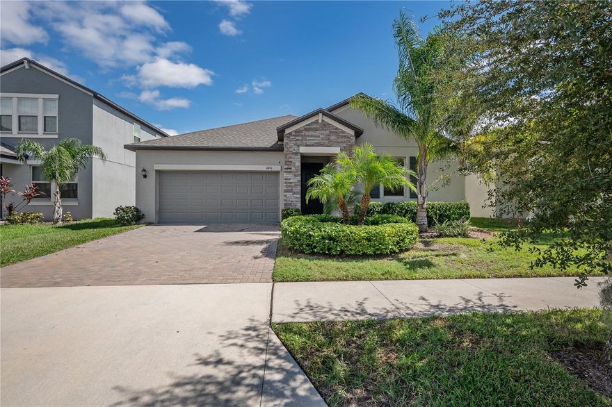 Assumable financing available at 3.125%. WOW. Ask us how! Welcome to this modern 4 bedroom, 3 bathroom home located in the gated community of Crestview Lakes in the heart of Riverview. Built in 2020, this house is a haven of comfort and convenience. As you pass through the gates, you'll notice a well-maintained community with a large playground and a dog park for your furry friends.  Upon entering, you'll be captivated by the open floor plan that seamlessly combines the living, dining, and kitchen spaces, creating a warm and inviting atmosphere perfect for gatherings. The kitchen is both functional and stylish, offering granite countertops, stainless appliances, and 42” Espresso cabinets.  The primary bedroom suite has a large shower outfitted with glass, an oversized soaking bath, double sinks, and a very large walk in closet. Step outside onto the covered lanai, where you can relax and enjoy the long awaited cooler weather in a tranquil outdoor space for both morning coffee and evening relaxation that is located inside a fully fenced backyard with a Rain Bird irrigation system.  This smart home features high-tech amenities like app-controlled front door and garage access, ring doorbell, the windows are all double paned vinyl and the electrical panel has already been set up for your EV charger. Crestview Lakes is a gated community with an 80-acre serene lake, perfect for various outdoor activities like picnics, canoeing, fishing, and paddleboarding. This captivating home is a must-see for those looking for modern comfort and a beautiful community. Schedule your private tour today to make this house your new home!