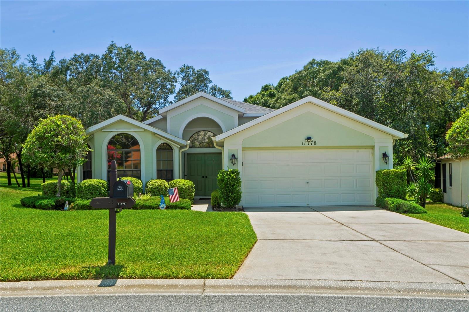 Discover the blend of comfort, luxury, and an active lifestyle in this stunning 3-bedroom, 2-bathroom house nestled in a vibrant 55+ gated community. Exquisite architectural design, vaulted ceilings, elegant formal living and dining rooms, generous family room, adjacent to the kitchen, with granite countertops and newer appliances, breakfast bar and eat-in kitchen nook. Primary suite has a walk-in closet and en-suite bathroom (dual sinks, garden tub, and separate shower). Enclosed back lanai with A/C adds valuable square footage. Park-like setting in back yard! Community pool, on-site restaurant and bar, clubhouse and so much more! HOA includes exterior maintenance, roof, paint, basic cable and internet service. Surround sound, hurricane shutters for all windows, new ceiling fans, new carpet in living, dining and family rooms. Roof and A/C age is 2017. Schedule a private showing today, and step into a life filled with luxury, comfort, and endless possibilities!