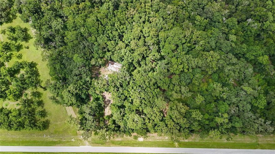 Enjoy country living less than 10 miles from Gainesville, Archer, and Williston. Whether you’re seeking a secluded homestead, agricultural land, or a timber investment, this collection offers excellent potential. This lot features 7.08 acres of wooded land, well and septic. Conveniently located on SW County Road 346 (paved), this property blends rural charm with easy access to schools, shopping, and major transportation routes. Bring your vision—whether for peaceful living, investment, or recreation—this is a rare opportunity to own a flexible, ready-to-use slice of Florida.  Also available with a bundle of parcels totalling over 85 acres, see MLS# GC535024
