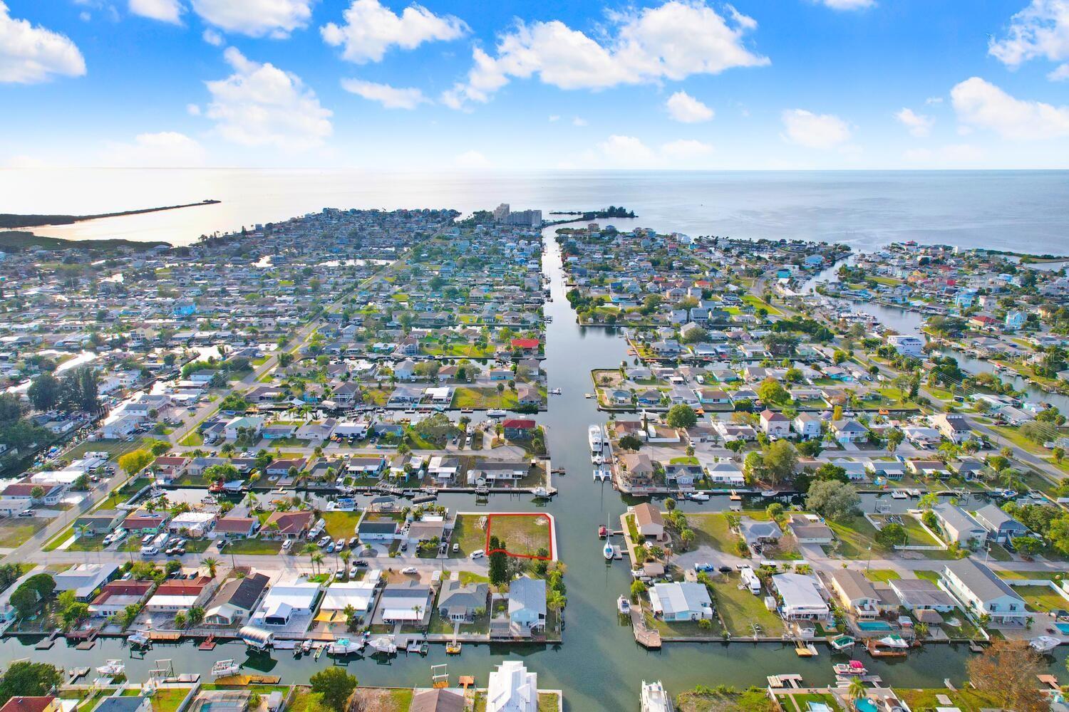 Welcome to a rare opportunity to own a double corner lot at the end of a cul-de-sac, situated along a serene main canal with direct Gulf access. This is a canvas awaiting your dream home vision. With a new seawall already in place, your waterfront living dreams are within immediate reach! Don't miss out on the chance to turn your dream home into a reality on this exceptional READY TO BUILD double corner lot. Seize the opportunity to live a life of luxury, relaxation, and endless waterfront adventures.