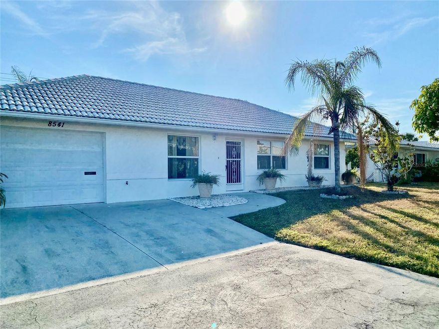 In the Heart of North Port, SOLID BLOCK HOME, Seller Had Home Custom Built in 2004, Designed with Entertaining in Mind, the Home Boasts   Plenty of Room to Entertain Family & Friends. Plus, Seller was Thinking Ahead with Plenty of Storage Cabinets and Hurricane Impact Resistant Windows! NOT in a Flood Zone Either!!  Beautifully Maintained Villa Provides COMFORT & Exceptional VALUE in this 55+ Community! The Floor Plan Flows as You Enter with OPEN Cathedral Ceiling Over the Great Room, Dining Area & Kitchen.  Short Hall from the Kitchen Leads to Bedroom #1 & Full Bath with Walk-In Shower, Linen Closet, & to the Laundry Area.   SPLIT Bedroom Floor Plan with Second Bedroom & Bath off the Dining Area.  From the Great Room to Extra Room in the DEN, Not to Mention the Huge ENCLOSED FLORIDA ROOM from the Dining Area!  Inviting Floor Layout Leads Out to Huge OPEN LANAI to Catch the Afternoon SEA BREEZE, or the SUNSHINE!!  Very LOW FEE for HOA Which Provides Exterior Pest Spraying, Exterior House Painting Every 6 Years, Power Wash the Tile Roof Every 2 Years, Plus the Lawn Mowing. North Port is a Family Community and the Villa's Location is Close to Churches, Medical, Shopping & Restaurants at Wellen Park, Warm Mineral Springs for Wellness, Atlanta Braves Spring Training Camp, Fun to See a Game & the Charlotte Sports Park Where Tampa Bay Rays have Spring Training Just 30 Minutes Away!! 10 Public Golf Courses Close By, Pickle Ball Courts, Beaches, Boating, & Fishing All Within 30 Minutes!! Great Value,  Don't Miss Out on This One.......  Come Enjoy the Florida Lifestyle