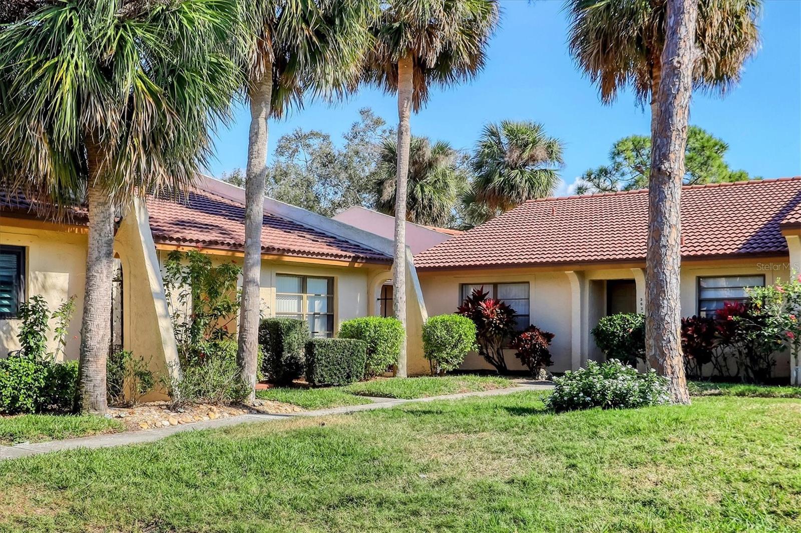 One or more photo(s) has been virtually staged. Come live the Florida lifestyle to the fullest in this charming 2 bedroom, 2 bath, corner Villa Located in Briarfield at
the Meadows. This spacious floorplan with high ceilings in the living and dining room give an open and airy feel
that's sure to please. Large bedrooms boost beautiful golf course views. Granite counter tops in kitchen and baths
and a beautiful screened in lanai for entertaining or enjoying a sunset. The Villa has a separate locked storage
room and a deeded parking space in a covered garage. The Villa also comes equipped with a Hurricane fabric
protection system by Astroguard. Briarfield residents enjoy a lifestyle like no other with access to all the amenities
at the Meadows which include but is not limited to: Private heated pool, pickleball courts, 15 miles of scenic oak-canopied
walking/biking trails and a community center. The Country Club Membership is optional offering 54
holes of golf, Har-Tru tennis courts, a junior Olympic pool, fitness center, restaurants and events. Conveniently
located minutes from University Town Center/Benderson Park and close to downtown. Award winning Siesta Key
Beach is only a short drive away. New Washer & Dryer 11/2024. New hot water heater and AC 2025. Don't miss this opportunity to call this beautiful villa your home!