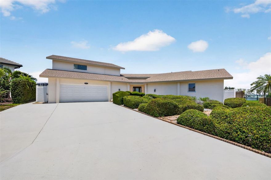 Positioned at the end of a quiet cul-de-sac in Belleair Beach, this rare waterfront opportunity offers 167 feet of protected deep-water frontage, exceptional privacy, and expansive open water views that are increasingly difficult to find. Designed to accommodate serious boating, the dock can support an approximately 60-foot vessel while still providing quick access to Clearwater Pass and the Gulf.  Spanning approximately 3,897 square feet, the residence includes four bedrooms, four bathrooms, a pool, and an attached two-car garage. While the interior is ready for a comprehensive cosmetic renovation, the property presents an exceptional opportunity to create a custom luxury waterfront home tailored to your own vision and style.  Importantly, many of the home’s most expensive and critical components have already been upgraded within the past several years, including the roof, HVAC systems, windows, and doors. With these major improvements already completed, a future owner can focus primarily on redesigning and modernizing the interior living spaces.  The existing floor plan offers generous living spaces and was thoughtfully positioned to take full advantage of the beautiful water views and natural light throughout the home. The protected waterfront setting combines the privacy boaters desire with the openness of wider water vistas, creating a rare balance that is difficult to replicate.  The rear northern exposure provides soft natural light throughout the day while still allowing for colorful sunrises and beautiful evening sunsets to become part of the daily waterfront experience. Outside, the pool, dock, and existing lift infrastructure provide a valuable foundation for creating an extraordinary outdoor living environment.  Surrounded by luxury waterfront homes in one of Belleair Beach’s most desirable locations, this is not simply a renovation project—it is a rare opportunity to create a personalized coastal estate with exceptional boating water, substantial frontage, and long-term value.
