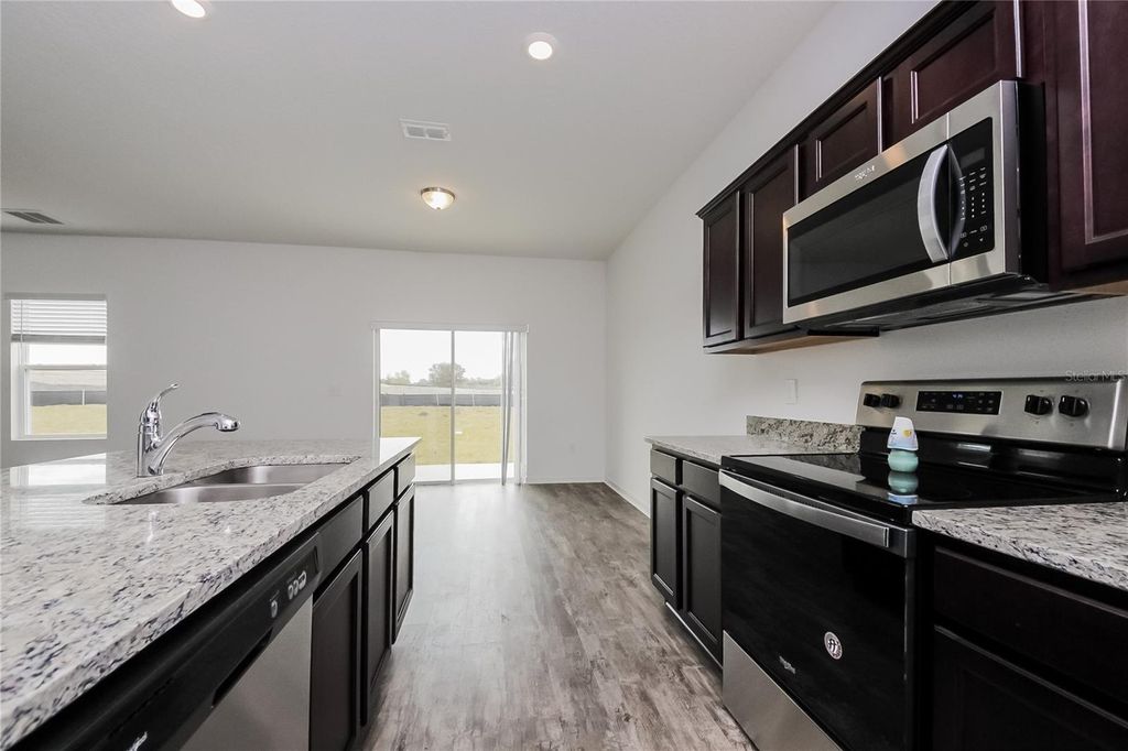 Photo of 126 Hidden Lake Loop, Haines City, FL 33844 (MLS # O6361223)