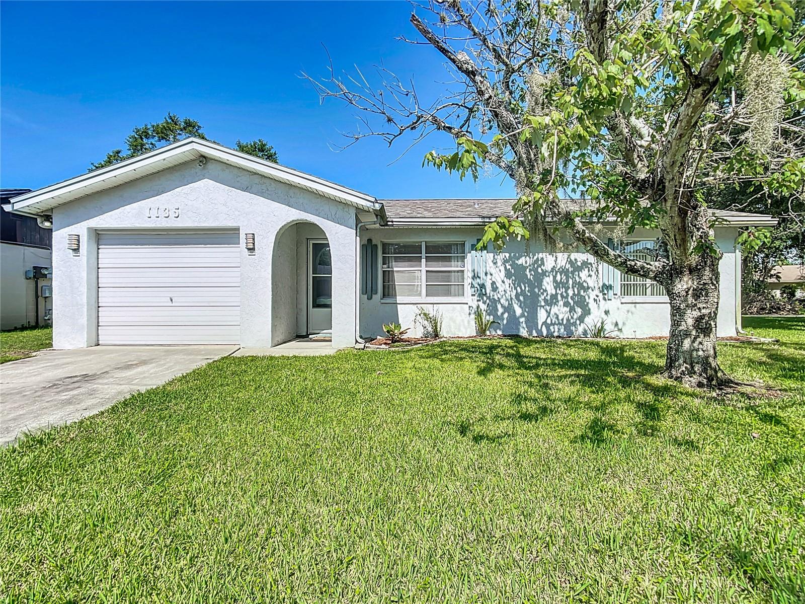 Updated 2/2 with Florida Room on Corner Lot – No HOA-Welcome to this clean and move-in ready 2-bedroom, 2-bath block home with garage, on a generous corner lot in a convenient Lakeland location. With just the right amount of space and a layout that flows, this home is easy to live in and easy to love. Inside, you'll find an open living and dining area with great natural light and laminate flooring throughout. The enclosed Florida room off the back adds bonus space—perfect for an office, TV room, or quiet coffee spot. The primary suite includes its own private bathroom, and the secondary bedroom also enjoys direct access to a full bath—ideal for guests or a roommate setup. Laundry hookups are located inside the one-car garage. Out back, the fenced yard features a small patio and storage shed, with room for gardening or pets.The Florida Room is block construction with an additional 200+- s.f.; A new roof was added just over a year ago, giving peace of mind for years to come. Convenient to shopping, schools, and major roads, this move in ready home is a solid option for a first-time buyer, down-sizer, or investor. Schedule your showing today.