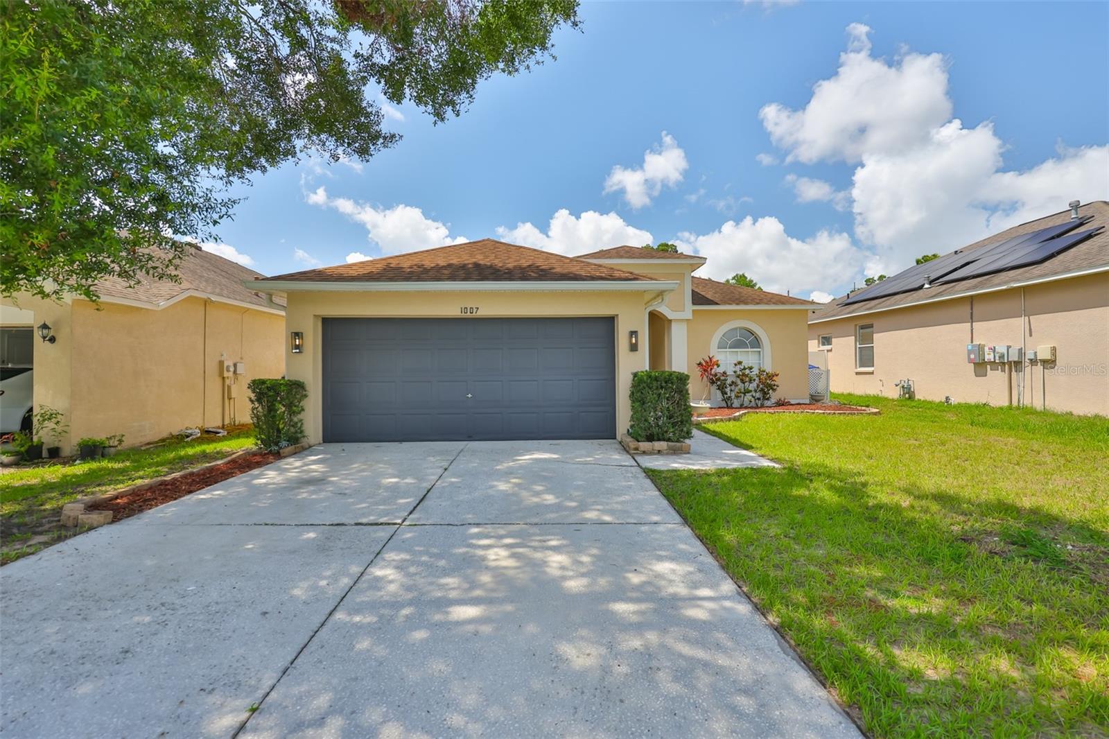 One or more photo(s) has been virtually staged. ATTENTION BUYERS! Welcome to this stunning, fully remodeled home located in the highly sought-after Copper Ridge community in Valrico, FL—a neighborhood known for its peaceful surroundings and access to top-rated schools. This 3-bedroom, 2-bath home with a 2-car garage has been thoughtfully updated from top to bottom, offering both style and comfort for modern living. Step into a bright and airy interior featuring new luxury vinyl plank flooring, fresh paint inside and out, and a brand new A/C system with new ductwork. The kitchen is a showstopper, boasting quartz countertops, sleek white shaker cabinetry, new stainless steel appliances, a deep luxury granite sink, and a stylish tile backsplash—all beautifully lit by contemporary lighting fixtures and natural light pouring in from the brand new sliding glass door and updated window blinds. The bathrooms have been completely transformed with designer tile work, LED backlit mirrors, rainfall showerheads, modern vanities, and a striking blend of marble, stone, and metallic finishes that elevate the space with spa-like sophistication. Step outside to your own backyard oasis! The screened and covered lanai features wood-look tile flooring and dual ceiling fans, perfect for relaxing or entertaining. The fully fenced yard offers both grassy space and a paved patio with a brick firepit, creating the ideal setting for gatherings year-round. Additional updates include a new water heater, new garage door opener, and epoxy-coated garage floors. The roof was replaced in 2018, providing peace of mind for years to come. Centrally located near popular shopping, dining, and entertainment spots, this move-in ready gem combines luxury upgrades with everyday convenience. Don’t miss your chance to own a beautifully updated home in one of Valrico’s most desirable communities!