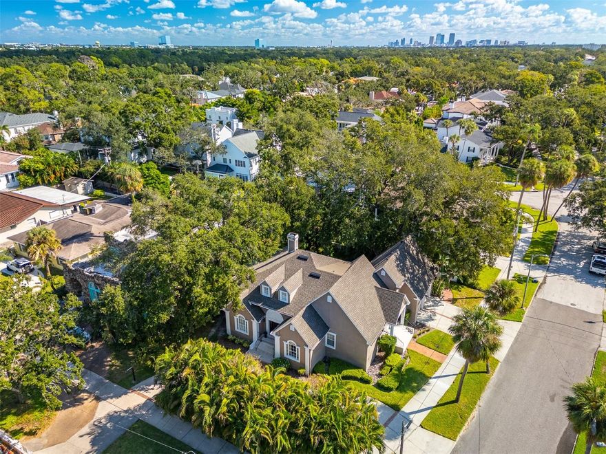 Welcome to this exceptional residence in the heart of Beach Park, where classic architectural charm blends seamlessly with thoughtful modern updates. From the moment you arrive, the inlaid marble entryway and grand staircase set an unmistakable tone of sophistication. Rich wood and marble flooring flow throughout the home, creating a warm and elegant ambiance at every turn.

A set of French doors leads to a versatile front bedroom that can easily function as a home office, library, or cozy sitting room. Another set of French doors opens into a formal living space, perfect for both entertaining and intimate gatherings.

At the center of the home, the kitchen exudes both style and functionality, featuring granite countertops, rich dark wood cabinetry with crown molding, stainless steel double ovens, a built-in microwave, a sleek side-by-side refrigerator, and dedicated wine storage. Recessed lighting casts a soft glow across the space, making it feel inviting from morning to night.

The family room is anchored by a stunning marble fireplace and a wall of windows with plantation shutters, creating a space that feels both open and inviting.

The primary suite, conveniently located on the main level, is a true retreat. The spa-inspired ensuite bathroom features dual sinks, an oversized walk-in shower wrapped in travertine from floor to ceiling, a built-in bench, and generous closet space. Upstairs, two additional bedrooms offer plenty of storage and share a beautifully finished full bath with travertine flooring, continuing the home’s timeless design aesthetic.

Step outside to a peaceful flagstone patio surrounded by lush landscaping and vibrant gardens, perfect for quiet mornings or elegant evening gatherings.

Major updates have already been completed, providing added comfort and peace of mind. A new roof and HVAC system were installed in April 2025, a new water heater was added in January 2025, and the electrical panel was replaced just three years ago.

This home is more than a place to live—it’s a place to relax, entertain, and grow into. Nestled in one of Tampa’s most prestigious neighborhoods, Beach Park offers rich history, timeless charm, and unmatched convenience. Residents enjoy swift access to Tampa’s scenic waterways and cultural attractions, as well as high-end shopping at WestShore Plaza and International Plaza. The location also places you minutes from major stadiums, Tampa International Airport, MacDill Air Force Base, and the stunning Gulf beaches. With nearby access to I-275 and the I-4 corridor, reaching Orlando, Polk County, and Florida’s charming west coast is effortless.

Luxury, location, and lifestyle come together beautifully in this remarkable Beach Park residence—a home designed to be cherished for years to come.