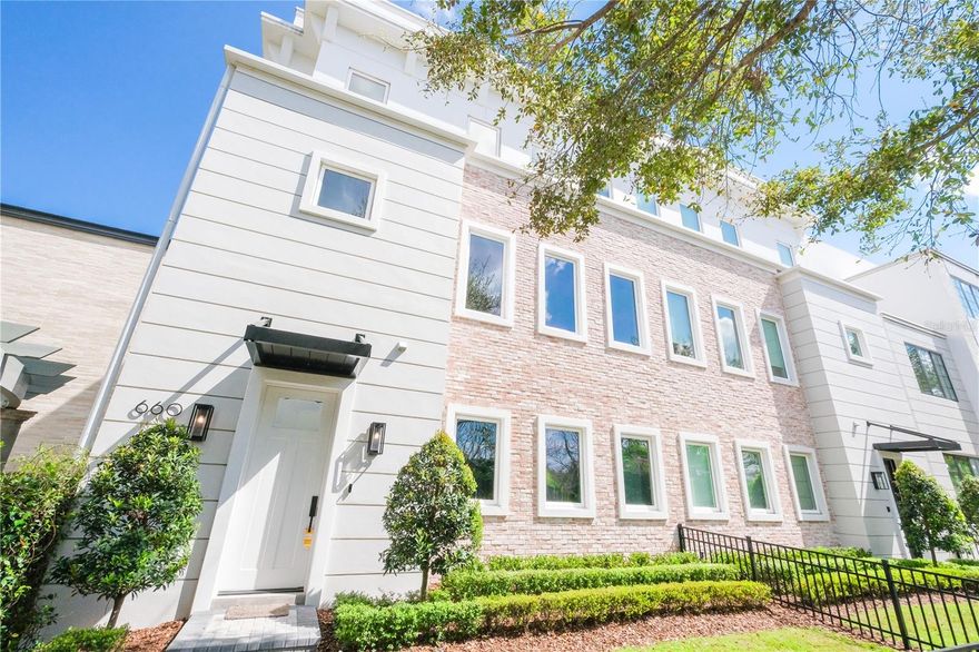 Impeccably designed by renowned architect Phil Kean, this modern luxury townhome is nestled in the Downtown Winter Park area. Walk to all the shopping and dining options Park Ave has to offer. Every detail has been meticulously thought out and crafted with love – from the 24x48 ceramic tile throughout, quartz countertops, and high end stainless steel appliances in the kitchen, to a hidden pantry behind cabinet doors and wet bar on first floor. Enjoy morning tea or coffee in your outdoor courtyard complete with fire pit or unwind at night with a glass of wine on your balcony off the kitchen. Plus you'll never worry about running out of space for storage again - this home comes equipped with an elevator servicing three floors plus a 3 car garage featuring an electric car charger. Your furry pets will love having their own fenced yard to run around while you entertain friends outdoors. As if it couldn't get any better - primary bedroom lies peacefully on the third floor accompanied by two additional bedrooms plus office/den located on second floor – each bathroom impeccably designed for comfort and convenience. This is truly one-of-a-kind property that offers everything you need for luxury living! Don't miss out on this unique opportunity - schedule a tour today!