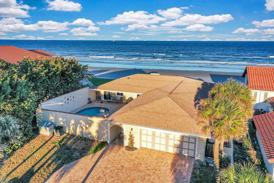 THIS AWESOME DIRECT OCEANFRONT 3 BR + BONUS ROOM / 3 BATH HEATED POOL HOME SITS HIGH ON A DUNE & HAS AMAZING OCEAN VIEWS OF THE PRISTINE ''NO DRIVE'' BEACH!! This beautiful home has many INTERIOR UPDATES as well as a BRAND NEW ROOF, NEW INSULATION and NEW IMPACT WINDOWS & DOORS (designed to block the light for the sea turtles hatchlings)! The light & bright home has a spacious open split bedroom floor plan & huge windows that overlook the jaw dropping ocean views! The inviting great room has a cozy GAS FIREPLACE & the fully-equipped REMODELED KITCHEN has Bamboo cabinetry, Granite countertops, new lighting, breakfast bar, ample storage space & a GAS COOKTOP! Watch the sunrise from the OCEANFRONT MASTER SUITE boasting expansive windows & breathtaking view! The master bath is also updated!  The guest bathroom has also been stylishly updated. The 
courtyard/pool area offers TOTAL PRIVACY and is perfect for relaxing, sunbathing or entertaining guests. The large lot has 75' OF
OCEAN FRONTAGE plus a SEAWALL for added security! There's ample parking on the extended paver driveway! The large oceanfront deck is designed with ample seating for you & your guests! Enjoy Florida living at it's finest!! ;Water: City