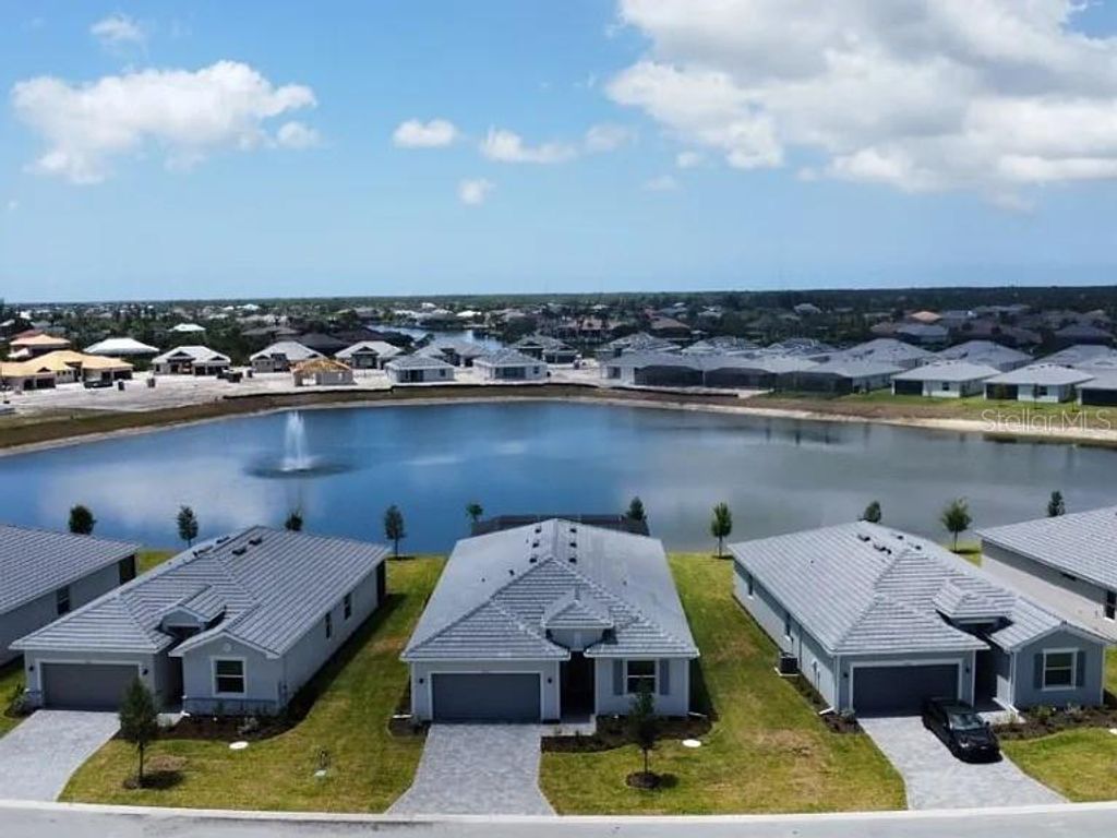 Photo of 7949 Lakes Edge Lane, Port Charlotte, FL 33981 (MLS # C7516516)