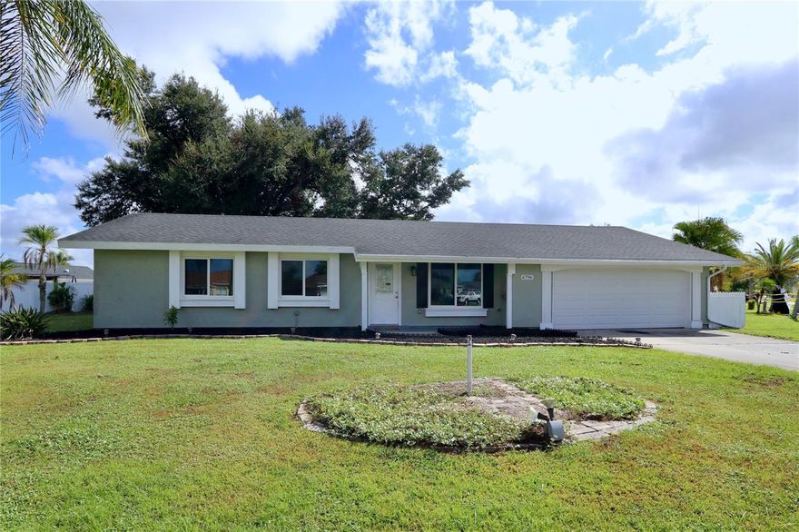 **YOU'VE FOUND THE ONE!** Central Water and Sewer and in the the very heart of North Port proper!!  Almost like NEW: a 2020 ROOF, 2017 IMPACT WINDOWS, 2020 A/C, BEAUTIFULLY REMODELED, ALL NEW appliances in 2023, NEW garage door 2024, a TESLA charging station, an OPEN FLOOR PLAN, ALL TILE FLOORS, CORNER LOT, TROPICAL YARD, 2 CAR GARAGE, JOCKEY CLUB POOL and COURTS, and a GREAT LOCATION.   This home is located in the Jockey Club, which has many community amenites including a heated pool, clubhouse, tennis, outdoor grilling area, and MORE!!  The home has an open floor plan, large rooms, wood-look tile floors throughout, a spacious kitchen, and a screened lanai. As you drive up to the home you'll love the mature palm trees lining the oversized corner lot. As you enter the home you'll walk into the bright and airy living room opening to the kitchen and dining area all with crown molding and chair rails. The open kitchen has luxurious leathered granite counter tops, solid wood cabinets with over counter lighting, an elegant tile back splash, an island with seating for 3, and a 4 piece stainless steel appliance set including a refrigerator, dishwasher, range, microwave as well as a single-basin undermount stainless steel sink with a garbage disposal. The spacious Master Bedroom has a large walk-in closet and an elegant en-suite bathroom. The master bathroom has an updated vanity, tiled walk-in shower with a built-in shower seat. The large 2nd bedroom easily accomodates a king-size bed with furniture. The spacious 3rd bedroom is off the dining area and could also be used as a den, game room, office or hobby room and has a sliding door accessing the covered and screened lanai. The 2nd bathroom has a tub with shower, tiled surround, and an updated vanity. Off the back porch is a majestic oak tree, with the tropical plantings, and a partially fenced yard. So many things to mention...all that is missing is YOU!!!! See this unique home today!!