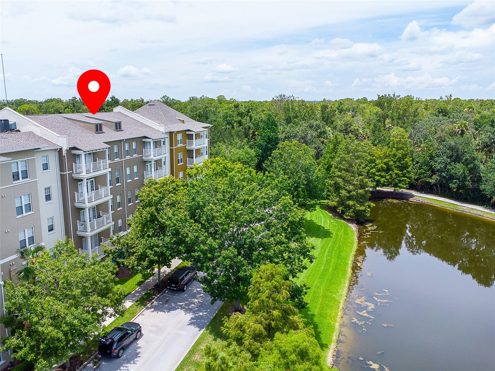 Highly desired Artisan Park condo with the perfect layout for maximum family privacy! Three bedroom unit features each bedroom on different sides of the condo allowing for the best situation for privacy within the family, Two and a half bathrooms with plenty of room to convert the half bath to a full bath if needed. Light open and airy floorplan with large kitchen and good sized breakfast nook and plenty of storage options, spacious living room with door leading to the screne balcony with peace evoking views of the pond. This unit comes with a sizeable storage locker located outside the front door and just around the corner as well as a detached one car garage,, Artisan Park offers an amazing Private clubhouse with bar, restaurant, resort style pool, hot tub, outdoor party area with large stone fireplace and large Bar B Que. The private clubhouse has a great fitness center as well as locker rooms with showers for added convenience, The town of Celebration built by Disney is a storybook place to have the privilege to call HOME with miles of hiking/biking trails restaurants, shops, community events like the Sunday Farmers Market, downtown concerts, a huge 4th of July celebration with the best fireworks show in the area, and let's not forget Snowing Nightly from Thanksgiving till New Years, This amazing condo situated in the most iconic town is just too good to be true schedule your private showing today, All info is intended to be accurate, it is the buyer and buyers agents responsibility to verify all details.
