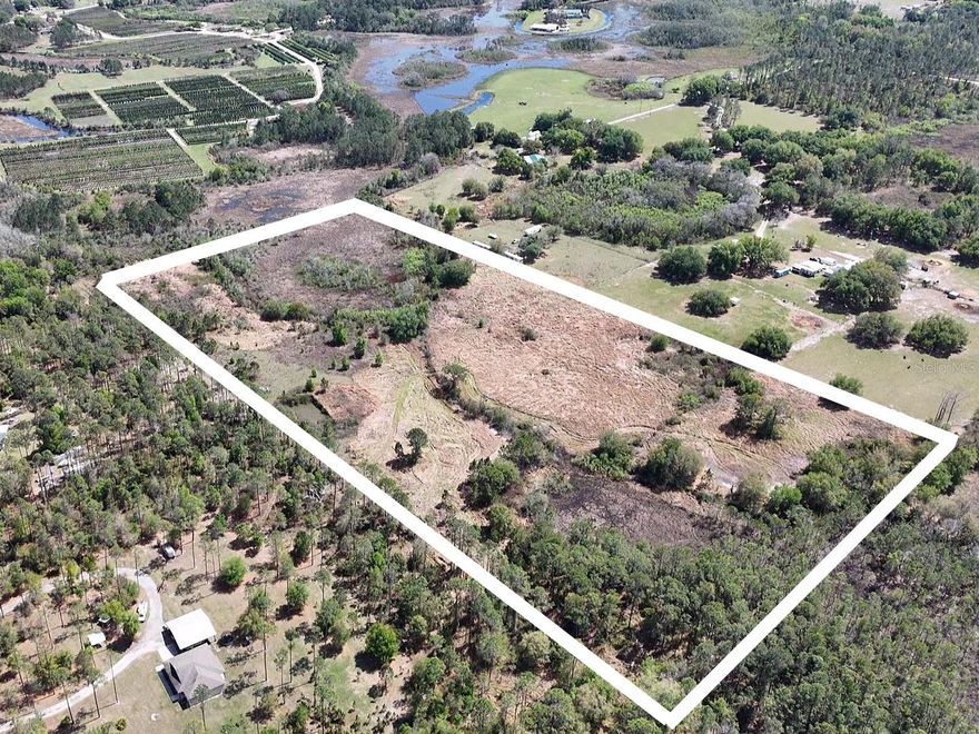 Discover a rare opportunity in one of Central Florida’s best-kept secrets—Groveland. Nestled in scenic Lake County, this expansive 20-acre property offers the perfect blend of privacy, natural beauty, and convenience. 14 acres of high and dry land provide an ideal homesite to build your custom dream home, surrounded by peaceful countryside and untouched nature. Towering oaks, open skies, and tranquil surroundings create your own private sanctuary—perfect for those seeking space, freedom, and a true connection to the outdoors. Groveland is known as the “City with Natural Charm,” offering rolling hills, abundant lakes, and a unique rural lifestyle that feels worlds away from the hustle—yet remains incredibly accessible.  As part of the greater Orlando metropolitan area, you’re just minutes to downtown Groveland, a short drive to Clermont, and within easy reach of Orlando for world-class dining, shopping, and entertainment. Enjoy the best of both worlds—quiet country living with modern conveniences nearby. With agricultural zoning, this property offers incredible flexibility for farming, animals, or simply enjoying wide open space with no HOA restrictions. Experience the true Lake County lifestyle—where nature, privacy, and opportunity come together.