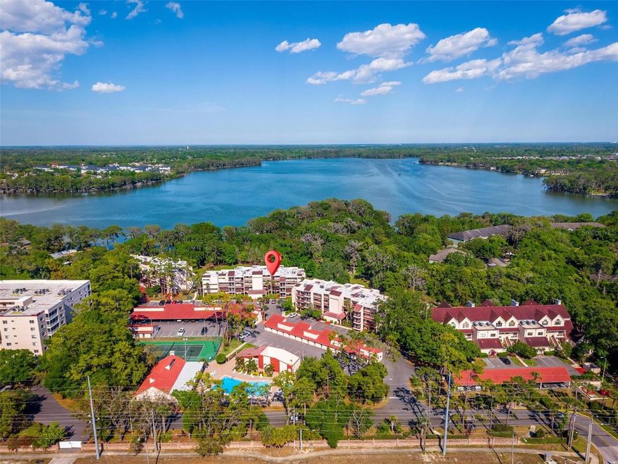 Live the Lakefront Lifestyle at Carmel by the Lake

Welcome to this beautifully maintained third-floor, two-bedroom, two-bath condo nestled in the highly desirable gated community of Carmel by the Lake. This light and bright unit offers a spacious layout with newer tile flooring added in 2023 and a private balcony that overlooks the beautifully landscaped grounds—ideal for enjoying your morning coffee or unwinding in the evening.

Inside, you'll find a well-appointed kitchen with updated appliances, including a refrigerator replaced in 2022, a stove from 2021, and a washer and dryer conveniently located in the in-unit laundry room. The building is elevator-accessible and recently received a brand-new roof with a 20-year warranty, along with a new elevator.

Carmel by the Lake is a private, resort-style community set on 42 acres of lush, manicured grounds with exclusive access to Lake Howell, a private ski lake. Residents enjoy a wide array of amenities, including a swimming pool, hot tub, tennis courts, pickleball and racquetball courts, a spacious clubhouse for social gatherings, and one covered assigned parking space. Boat ramp access and storage are also available through the HOA.

The monthly association fee includes cable TV, internet, water, sewer, and exterior building maintenance, offering exceptional value and peace of mind. Located just across from the Mega Walmart and minutes from a variety of restaurants and shops along Highway 436, the community is also just 30 minutes from Orlando International Airport and 45 minutes from Disney World.

This is a rare opportunity to enjoy tranquil lakefront living with unbeatable amenities and convenience. Don’t miss your chance to make this your new home—schedule your private showing today!