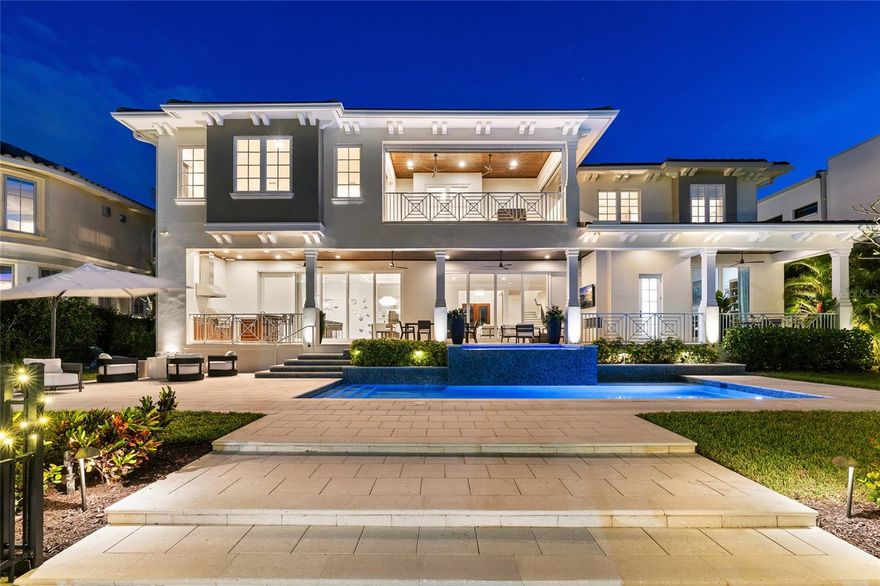 Experience the pinnacle of waterfront luxury in this exceptional coastal estate, where sweeping open water views and unforgettable sunsets set the stage for an unparalleled living experience. Masterfully built by renowned builder Don Hughes, this residence is ideally positioned on a protected deep-water canal just two homes from the open bay—offering both privacy and effortless access to Tampa’s most coveted boating waters.

Designed to embrace the very best of waterfront living, the expansive open-concept floor plan seamlessly blends refined elegance with everyday functionality. The chef’s kitchen serves as the heart of the home, overlooking the dining and family areas—perfectly suited for both intimate gatherings and large-scale entertaining. Outfitted with top-of-the-line appliances, including dual Asko dishwashers, a 48” Sub-Zero refrigerator, full Sub-Zero wine storage, and a 48” Wolf gas range with dual ovens, along with an additional Wolf wall oven and microwave, every detail has been thoughtfully curated. Custom cabinetry by Brian Castor and exquisite stone countertops complete the space with timeless sophistication.

The main level features a versatile guest suite or private study with a full bath that also functions as a pool bath. Soaring 11’4” ceilings and substantial crown molding enhance the home’s grand scale while maintaining a warm, livable feel.

Upstairs, five generously sized ensuite bedrooms accompany the luxurious primary retreat. A spacious bonus room with vaulted ceilings, wet bar, and adjacent full bath offers the perfect setting for relaxation or entertaining. The primary suite is a true sanctuary, thoughtfully designed to capture panoramic water views, and features a private balcony overlooking the heated saltwater pool, spa, and beautifully manicured grounds.

Outdoor living is equally impressive, with a covered lanai that seamlessly extends the interior living space and is complete with a fully equipped outdoor kitchen—ideal for enjoying Florida’s year-round lifestyle. Along the water’s edge, enjoy a 540-square-foot dock outfitted with a 13,000 lb Deco boat lift and a 6,000 lb jet ski lift accommodating two watercraft, providing the ultimate setup for boating enthusiasts.

Additional highlights include a circular driveway leading to a three-car garage with epoxy flooring, a thoughtfully designed mudroom with a stackable washer and dryer and drop zone, secondary upstairs laundry room, engineered distressed hardwood flooring, solid core doors, a level 5 drywall finish, PGT WinGuard hurricane-impact windows, private elevator, a newer seawall, and a full-home generator—delivering both luxury and peace of mind.

This is a rare opportunity to own a meticulously crafted waterfront residence that perfectly balances timeless design, modern convenience, and the very best of Tampa Bay living.