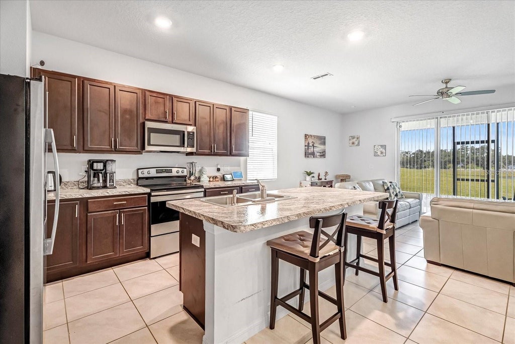 Photo of 141 Feltrim Reserve Boulevard, Davenport, FL 33837 (MLS # O6414336)
