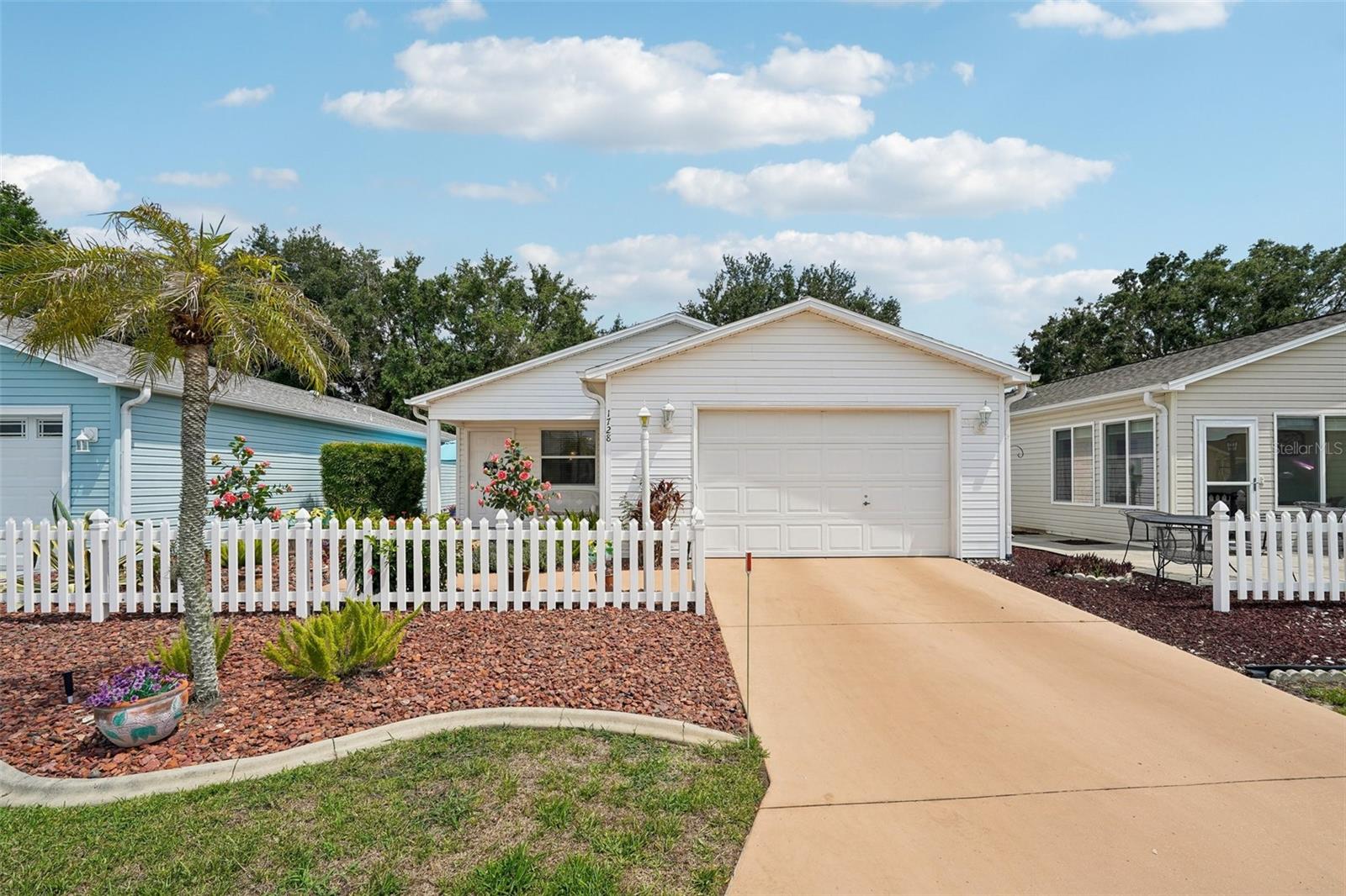 BRAND NEW 2025 TRANE HVAC SYSTEM with 10 year warranty. BOND PAID IN FULL! STUNNING LAMINATE FLOORING throughout entire home! A PRIME LOCATION only minutes from both SUMTER LANDING and SPANISH SPRINGS for entertainment, dining, shopping, and enjoying live music at the Squares. Nearby amenities include Tierra Del Sol Pool and Restaurant along with multiple golf courses! This 2 bed, 2 bath home features an open layout with formal dining, living room, and kitchen with an eating bar. The LARGE KITCHEN boasts extra cabinets, great countertop space, and pantries with sliding drawers for easy access. The LARGE MAIN BEDROOM has a HUGE walk in closet and a bathroom with a modern walk in shower with updated seating. The SECOND BEDROOM has a built-in desk with cabinets overhead, plus a large closet. The adjacent bathroom has a tub and shower combination which is in PRISTINE condition. Sliding glass doors in the living room lead you to a LARGE PATIO which is PRIVATE due to the maintained yard, mature landscaping, and working irrigation system. Yard decorations go with the owner. The GARAGE COMFORTABLY FITS A CAR AND A GOLF CART, has a utility sink, washer and dryer, many built in cabinets for storage and an attic with a pull down ladder. Ideal for investment, with a rental analysis sheet available and property management services offered. THIS UPDATED, CONVENIENTLY LOCATED HOME WON'T LAST LONG SO SCHEDULE YOUR SHOWING TODAY!