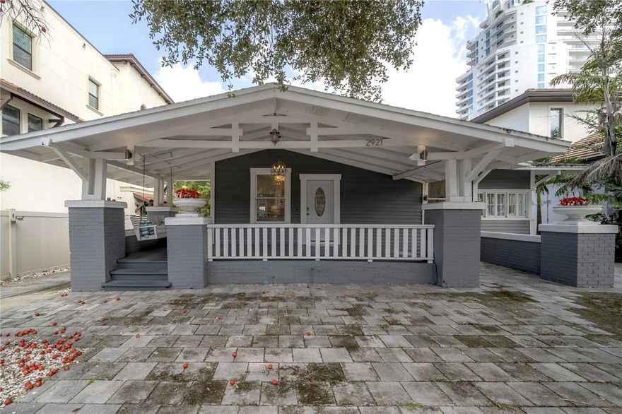Just 50 feet off iconic Bayshore Boulevard, lies an exquisite, meticulously renovated historic home that exemplifies modern luxury living in South Tampa. This poolside sanctuary boasting four bedrooms, three baths, and amazing new tile flooring that speaks to the discerning owner. As you approach, you are greeted with an extended covered porch, outfitted with the crown jewel of bungalows, the porch swing which faces Bayshore. Stepping inside, you'll be greeted by an open floor plan that seamlessly merges the living areas with a kitchen that can be described as a visual masterpiece, highlighted with the perfect hue of natural light while maintaining privacy. Adorned with opulent white marble veined countertops and gleaming stainless steel appliances featuring a new top of the line refrigerator, built in stove, wine fridge and microwave, this kitchen is a testament to both style and functionality. An enchanting revelation awaits as you enter the living room, where a custom fire and ice themed gas fireplace takes center stage, radiating warmth and charm throughout the space. Beneath your feet, the refinished high end resplendent porcelain tile, adding a touch of timeless elegance to the surroundings. The Florida room, a zenful haven, opens to reveal a vista of the sprawling porch and inviting pool area, enveloped by lush tropical landscaping serving as nature's canvas, harmonizing seamlessly with the nearby waterfront of Tampa Bay. The balcony overlooking the pool area is outfitted with a chef cook station, equipped with a gas grill, cooktop, fridge and a seating area for your guests, enhancing the Floridian experience. There is also a garage that can be converted to a pool house back as well. Discover unparalleled serenity in the expansive master suite, where space abounds for a comfortable sitting area. The modern primary bathroom is adorned with marble tile walls with an indulgent rain shower, exquisite dual sink countertops, and an iconic historic original clawfoot tub preserving the home's timeless charm. Ascend to the second floor, and you will find the final fourth bedroom, overlooking the pool is a testament to modern craftsmanship and ingenuity and the perfect getaway for your visiting guests. This home is a posh masterpiece sitting in the heart of South Tampa. It is a perfectly balanced fusion of modern and classic elegance. Your opportunity to immerse yourself in South Tampa luxury living has arrived, and it awaits your presence. This home is more than a must-see; it is an invitation to live your dreams in a historic bungalow with the view of Bayshore Boulevard. Live the South Tampa Lifestyle with everything your heart could desire from the pool to the fireplace, this house has it all.