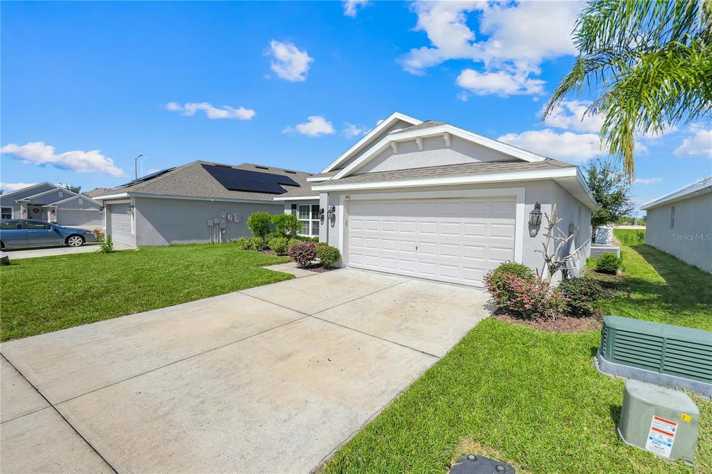 Photo of 491 Meadow Pointe Drive, Haines City, FL 33844 (MLS # O6451652)