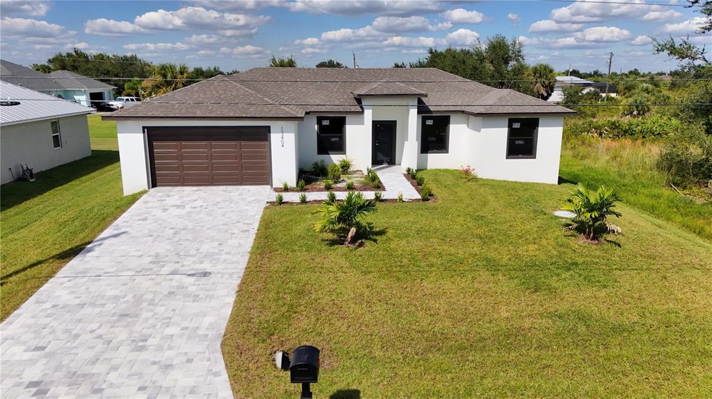 Photo of 13404 Cedar City Avenue, Port Charlotte, FL 33981 (MLS # O6339634)