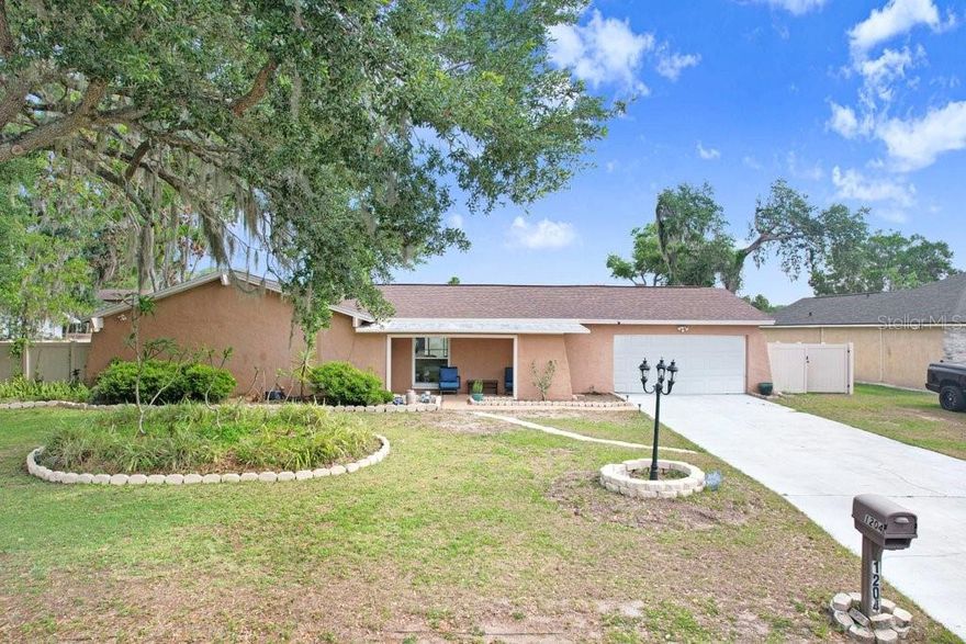Welcome to 1204 Lady Guinevere — a spacious 4-bedroom, 2-bath home with a dedicated office, designed for comfortable living and entertaining. Featuring laminate flooring throughout, this home offers an open and inviting feel with plenty of space for the whole family. Step outside to your private backyard oasis complete with a gorgeous screened pool and lanai, plus an expansive outdoor sitting area perfect for relaxing or hosting guests year-round. The large, fully fenced backyard with durable PVC fencing provides both privacy and security.  Located in a desirable community with lake access and NO HOA or CDD fees, this property gives you the freedom to enjoy your home without added restrictions or expenses. Additional highlights include a 2020 roof, generous living spaces, and endless potential inside and out.  Don’t miss this opportunity to own a beautifully maintained home with space, privacy, and sought-after amenities!