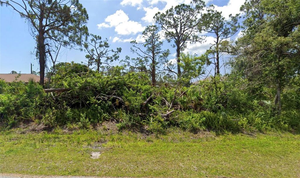 Photo of 5290 Johnson Terrace, Port Charlotte, FL 33981 (MLS # D6141606)