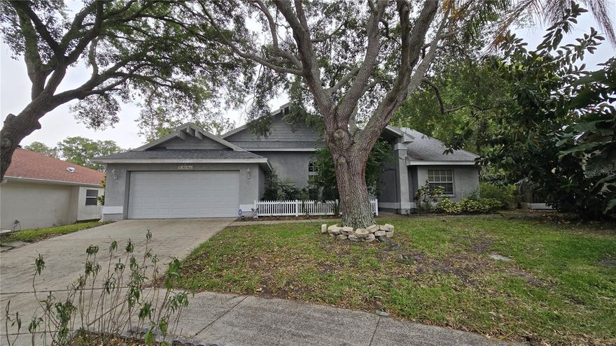 Spacious 3BR/2BA Tarpon Springs Opportunity with a Bonus Room & Huge Lot!!! Unlock the potential at 1040 Tradewinds Dr! This spacious 3-bedroom + bonus room, 2-bathroom block home with a 2-car garage offers 2,076 sqft of living space on an oversized 11,121 sqft lot (0.25 acres) in a desirable Tarpon Springs location. Best of all, it’s located in a non-flood zone! Built in 1994, this home has fantastic bones and a flexible layout ready for your personal updates and cosmetic touches. The bonus room is currently being used as a home office, making it perfect for remote work, a playroom, gym, or potential 4th bedroom conversion. Enjoy relaxing mornings or entertaining guests in the screened rear porch overlooking the spacious backyard with plenty of room to create your dream outdoor oasis. Major peace of mind comes with a roof replacement completed in 2017. Whether you’re an investor, first-time buyer, or someone looking to customize a larger home in a prime location, this property presents an incredible value-add opportunity in one of Pinellas County’s most sought-after areas. Conveniently located near some of the area’s top destinations. Approximately 3 miles to Historic Downtown Tarpon Springs & Sponge Docks, 5 miles to Sunset Beach, 6 miles to Fred Howard Park & Beach, 2 miles to shopping, dining, and grocery stores, 8 miles to Innisbrook Golf Resort and 24 miles to Tampa International Airport. With strong block construction, a large lot, newer roof, and endless upside potential, this is your chance to create something truly special in Tarpon Springs!