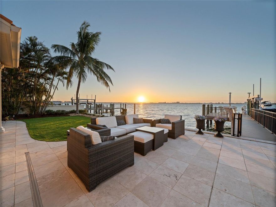This exceptional waterfront estate in Brightwater Beach Estates offers the ultimate blend of luxury, comfort, and coastal living. Priced below recent appraisal.  Positioned on deep, open water with panoramic views of Boca Ciega Bay and the iconic Don Cesar, this home delivers a true resort-style experience in one of St. Pete Beach’s most desirable neighborhoods.
Just steps across the street from the sandy Gulf beaches, you’ll enjoy the rare convenience of both beach and boating lifestyle. Walk to shoreline sunsets, beach cafés, shopping, and entertainment — and you're only a short drive to Downtown St. Pete, known for its arts, dining, waterfront parks, and vibrant culture.
Inside, soaring ceilings and expansive windows fill the home with natural light and showcase the stunning water views. The gourmet kitchen is equipped with Sub-Zero, Wolf, and Bosch appliances, including a gas cooktop, custom cabinetry, and elegant stone finishes. The main-level primary suite provides private waterfront views along with a spa-inspired bath and custom walk-in dressing room.
The upper level is designed for entertaining — offering a spacious media/game lounge, wet bar, guest suite, and a private balcony overlooking the bay.
Step outdoors to your private waterfront oasis featuring a heated PebbleTec saltwater pool & spa, multiple outdoor seating and dining areas, lush tropical landscaping, and a new composite dock with water, electric, and a 20,000 lb boat lift providing quick access to the Gulf.
Additional highlights include hurricane impact windows & doors, smart home automation, travertine flooring, plantation shutters, custom lighting, newer roof with hurricane clips, and a 4-car garage with ceiling height ideal for vehicle lifts — perfect for car collectors.
This newly refinished estate delivers luxury, lifestyle, and location — all in one spectacular, turn-key waterfront residence. Buyer to verify all dimensions and sf are approximate   originally built in 1969 newly reovated  and meticulously rebuilt from bottom up  in 2018