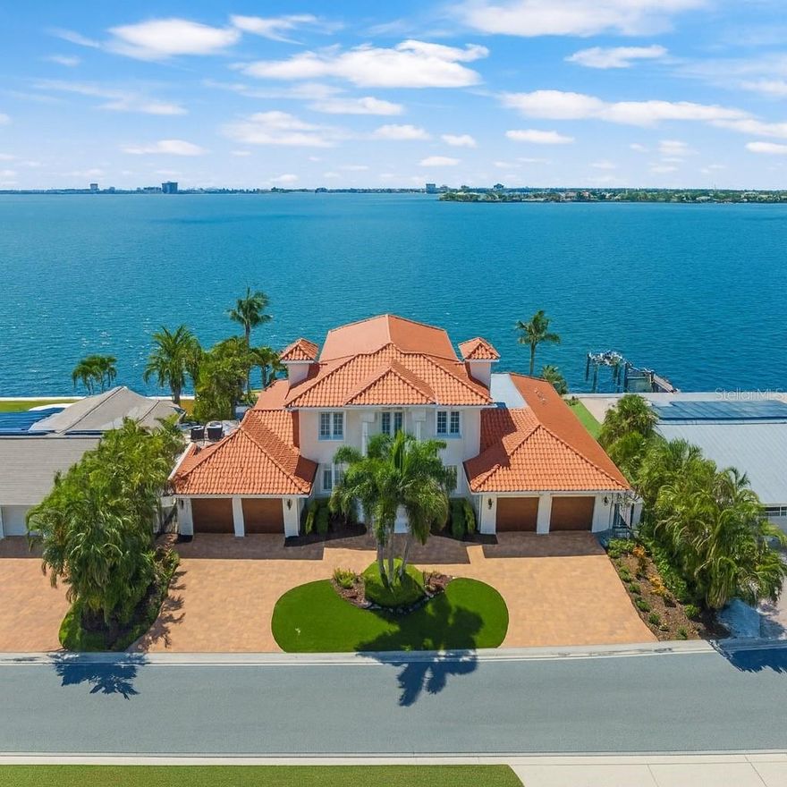 This exceptional waterfront estate in Brightwater Beach Estates offers the ultimate blend of luxury, comfort, and coastal living. Positioned on deep, open water with panoramic views of Boca Ciega Bay and the iconic Don Cesar, this home delivers a true resort-style experience in one of St. Pete Beach’s most desirable neighborhoods.
Just steps across the street from the sandy Gulf beaches, you’ll enjoy the rare convenience of both beach and boating lifestyle. Walk to shoreline sunsets, beach cafés, shopping, and entertainment — and you're only a short drive to Downtown St. Pete, known for its arts, dining, waterfront parks, and vibrant culture.
Inside, soaring ceilings and expansive windows fill the home with natural light and showcase the stunning water views. The gourmet kitchen is equipped with Sub-Zero, Wolf, and Bosch appliances, including a gas cooktop, custom cabinetry, and elegant stone finishes. The main-level primary suite provides private waterfront views along with a spa-inspired bath and custom walk-in dressing room.
The upper level is designed for entertaining — offering a spacious media/game lounge, wet bar, guest suite, and a private balcony overlooking the bay.
Step outdoors to your private waterfront oasis featuring a heated PebbleTec saltwater pool & spa, multiple outdoor seating and dining areas, lush tropical landscaping, and a new composite dock with water, electric, and a 20,000 lb boat lift providing quick access to the Gulf.
Additional highlights include hurricane impact windows & doors, smart home automation, travertine flooring, plantation shutters, custom lighting, newer roof with hurricane clips, and a 4-car garage with ceiling height ideal for vehicle lifts — perfect for car collectors.
This newly refinished estate delivers luxury, lifestyle, and location — all in one spectacular, turn-key waterfront residence. Buyer to verify all dimensions and sf are approximate   originally built in 1969 newly reovated  and meticulously rebuilt from bottom up  in 2018