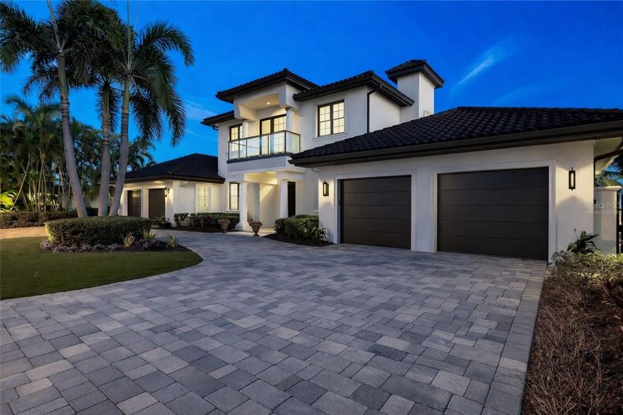 This exceptional waterfront estate in Brightwater Beach Estates offers the ultimate blend of luxury, comfort, and coastal living. Priced below recent appraisal.  Positioned on deep, open water with panoramic views of Boca Ciega Bay and the iconic Don Cesar, this home delivers a true resort-style experience in one of St. Pete Beach’s most desirable neighborhoods.
Just steps across the street from the sandy Gulf beaches, you’ll enjoy the rare convenience of both beach and boating lifestyle. Walk to shoreline sunsets, beach cafés, shopping, and entertainment — and you're only a short drive to Downtown St. Pete, known for its arts, dining, waterfront parks, and vibrant culture.
Inside, soaring ceilings and expansive windows fill the home with natural light and showcase the stunning water views. The gourmet kitchen is equipped with Sub-Zero, Wolf, and Bosch appliances, including a gas cooktop, custom cabinetry, and elegant stone finishes. The main-level primary suite provides private waterfront views along with a spa-inspired bath and custom walk-in dressing room.
The upper level is designed for entertaining — offering a spacious media/game lounge, wet bar, guest suite, and a private balcony overlooking the bay.
Step outdoors to your private waterfront oasis featuring a heated PebbleTec saltwater pool & spa, multiple outdoor seating and dining areas, lush tropical landscaping, and a new composite dock with water, electric, and a 20,000 lb boat lift providing quick access to the Gulf.
Additional highlights include hurricane impact windows & doors, smart home automation, travertine flooring, plantation shutters, custom lighting, newer roof with hurricane clips, and a 4-car garage with ceiling height ideal for vehicle lifts — perfect for car collectors.
This newly refinished estate delivers luxury, lifestyle, and location — all in one spectacular, turn-key waterfront residence. Buyer to verify all dimensions and sf are approximate   originally built in 1969 newly renovated  and meticulously rebuilt from bottom up  in 2018 seller to credit buyer outside paint credit with an acceptable offer. Photo 1 is virtually painted.