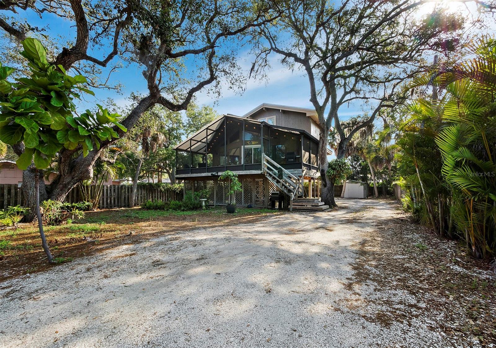 Available now for an annual or 6-month lease, this furnished home is located in a coveted Siesta Key neighborhood, just moments from Siesta Village and Siesta Beach. It combines rustic charm with modern comfort, featuring a spacious living and dining area, an open kitchen with a breakfast bar, and a screened porch with tropical views. The master bedroom loft includes an en-suite bathroom and walk-in closet. With ample space for RVs or trailers and recent updates like new porch sliders, custom tile showers, and a 2015 A/C unit, this home offers everything you need for island living. Contact us to schedule a private showing!