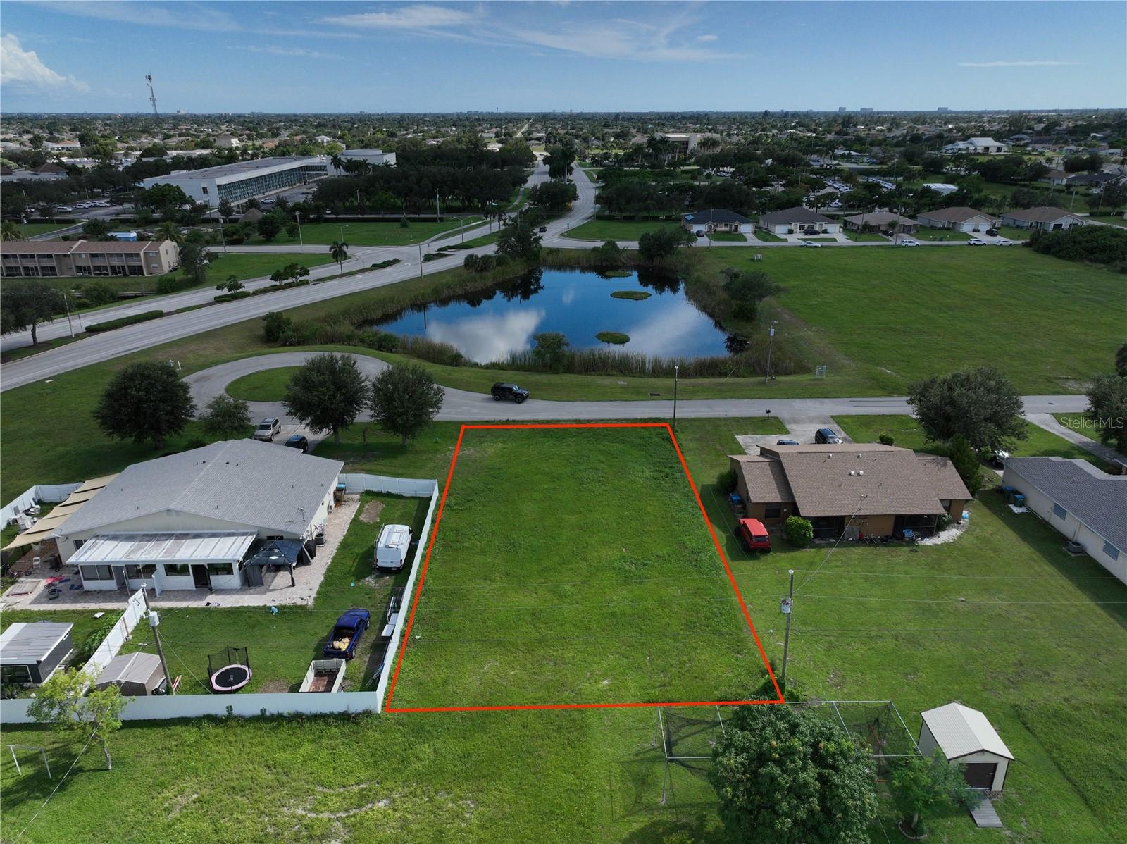 Discover the perfect opportunity to build on this spacious vacant lot, just over a quarter acre, ideally situated in Cape Coral at 705 SE 9th Terrace. Nestled on a quiet cul-de-sac, this desirable homesite offers a peaceful setting with the added benefit of being directly across from a tranquil pond, providing beautiful water views. The neighborhood features well-maintained homes, commercial businesses, and a welcoming community atmosphere, while still offering easy access to shopping, dining, parks, schools, and major roadways for everyday convenience. With its prime location and appealing surroundings, this buildable lot is an excellent choice for those seeking to live and work in one of Cape Coral’s most vibrant areas.
Buyer and Buyer’s Agent are responsible for conducting their own due diligence, including but not limited to verifying property boundaries, availability of utilities, flood zone designation, soil conditions, and any restrictions with the appropriate county or governing authorities. Neither the seller, listing agent, nor broker shall be held liable for any errors, omissions, or misstatements.