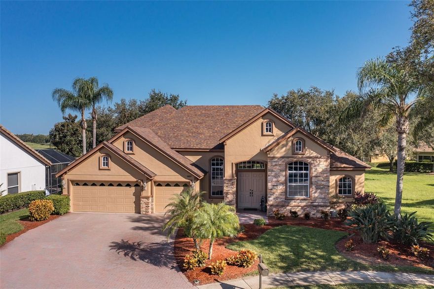 ** PRICE IMPROVEMENT ** CHAMPIONS CLUB GOLF COURSE ~ LUXURY HOME! Welcome to this stunning 4-bedroom, 3-bath home with a bonus room and office, nestled on the prestigious Fox Hollow Golf Course. Spanning 3,160 square feet, this home boasts soaring ceilings and UPDATES GALORE, including a ** BRAND NEW ROOF**  The spacious kitchen features custom cabinetry & gleaming granite countertops and opens to the family room with pool & gorgeous golf course views all the way down the course!  The living room features a new custom electric fireplace which creates a cozy atmosphere. Tile and wood flooring flow throughout the home, adding a touch of elegance. The owner's suite is spacious & boasts walk-in closet & en suite bath is pampering with relaxing garden tub, double vanity & walk-in shower. Bedrooms 2 & 3 are generously sized and guest bath offers tub/shower & newer granite counters. The 4th bedroom is in rear of the home & offers its own en suite bath - the PERFECT IN-LAW SUITE! Upstairs you will find a very large bonus room with a roomy closet. Step outside to your private oasis, complete with a sparkling pool & pavered lanai, the perfect space for relaxing or entertaining. The exterior features custom stone accents, BRAND NEW ROOF, and a sprawling driveway, all located on a quiet CUL-DE-SAC. Many recent upgrades of this amazing home: two NEW HVAC's (2019), BRAND NEW ROOF ((2024), NEWER kitchen appliances (2023), NEWER washer/dryer (2018), NEW Granite in all bathrooms (2019), NEW custom fireplace (2023), NEW pool resurfaced (2015),NEW pool pump (2020), NEW pool vacuum (2024), NEW landscape lighting (2024), NEW expanded patio addition (2022), NEW fenced yard (2020) NEW exterior & interior paint (2018) & so much more! Champions Club is a Luxury Golf Course community which offers clubhouse, resort style heated swimming pool, tennis, pickle ball, basketball, fitness center, many planned activities for year round enjoyment for its residents! Conveniently located close to EVERYTHING - restaurants, medical, shops, Starkey Market, walking/biking trails, local beaches, short drive to Tampa, Tampa International Airport, St. Pete/Clearwater Airport & more! Zoned for EXCELLENT TRINITY SCHOOLS ~ Trinity Elementary, Seven Springs Middle, J.W. Mitchell High. Don't miss out on this exceptional opportunity to call Champions Club home ~ One of a kind community in the Tampa Bay Area! Start Living the Florida Dream today in this Luxury Resort Style Community!! BEST VALUE IN CHAMPIONS CLUB!!