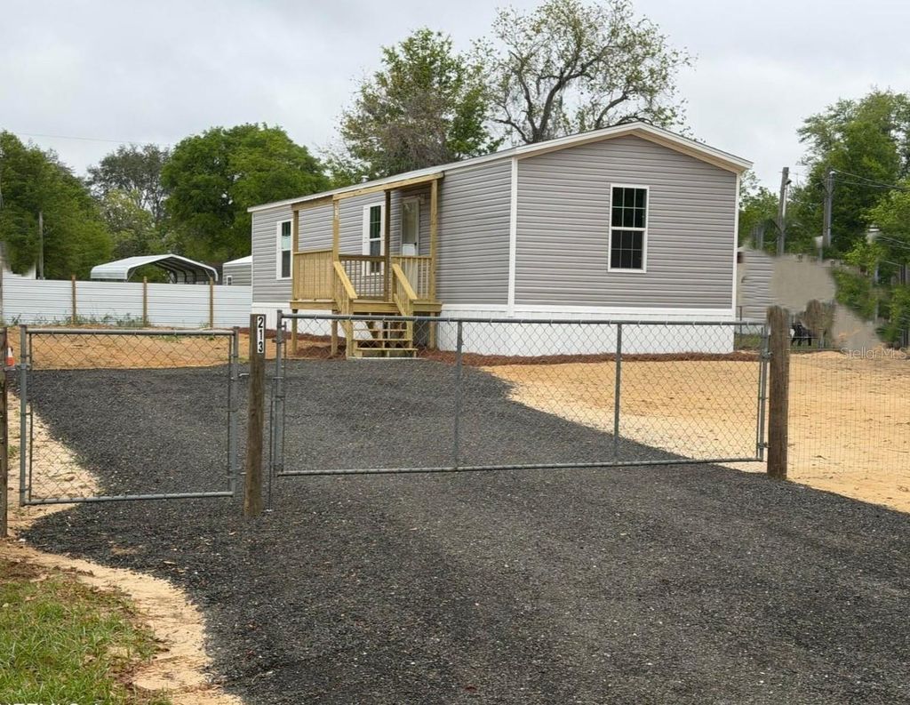 Photo of 213 Milton Avenue, Interlachen, FL 32148 (MLS # S5146756)